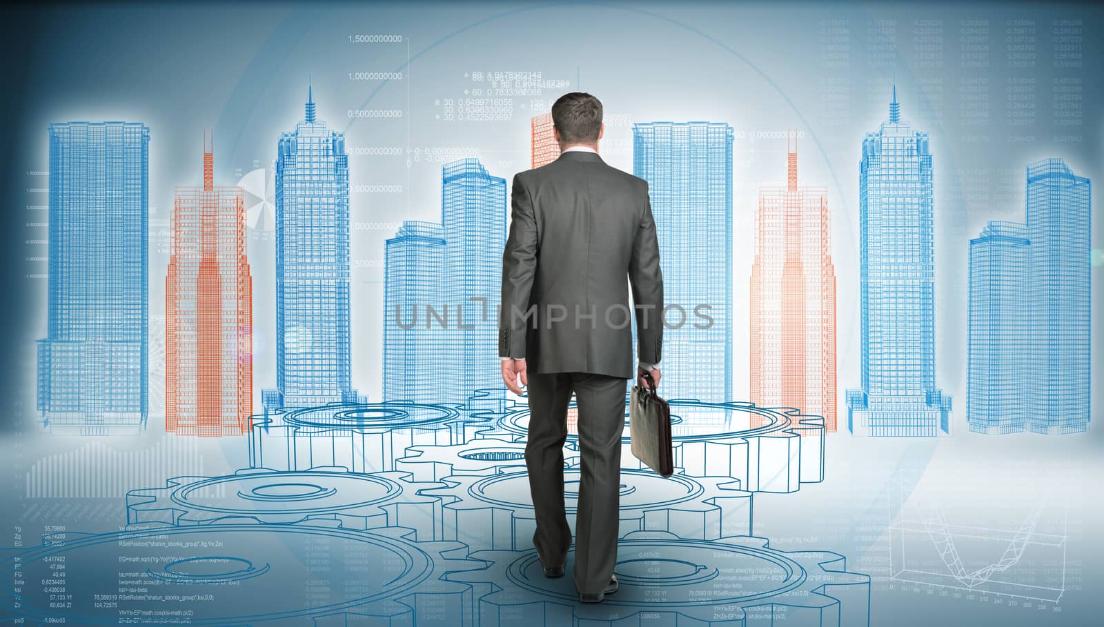 Businessman in suit holding briefcase and goes forward. Rear view. Wire-frame glowing building on background. Business concept