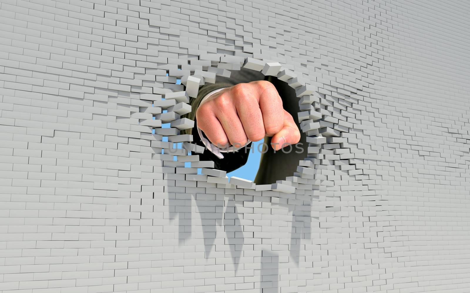 Fist punching through brick wall. Business concept