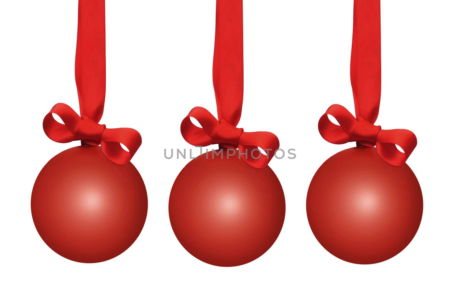 Red christmas baubles with ribbon bows over a white background