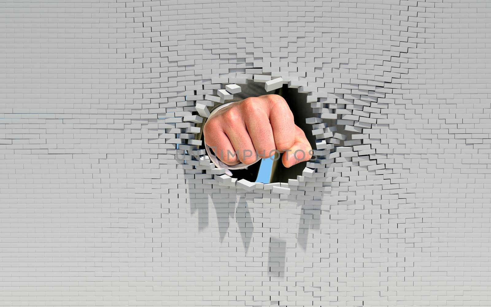 Fist punching through brick wall. Business concept