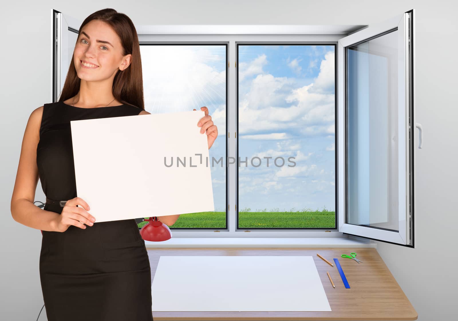 Beautiful businesswoman in dress smiling and holding empty paper sheet. Open window as backdrop by cherezoff