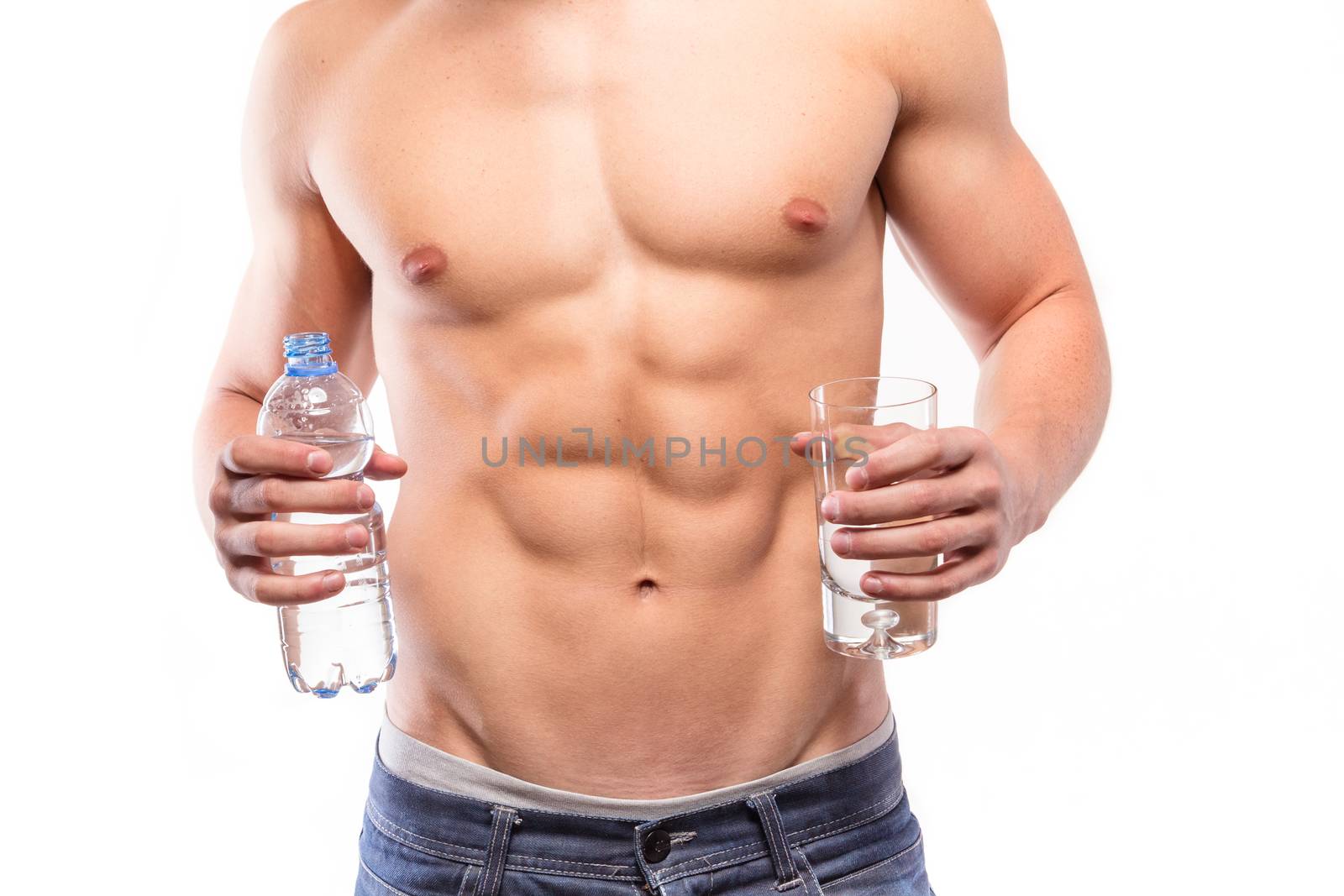 Muscular man torso with bottle and water - studio shoot 