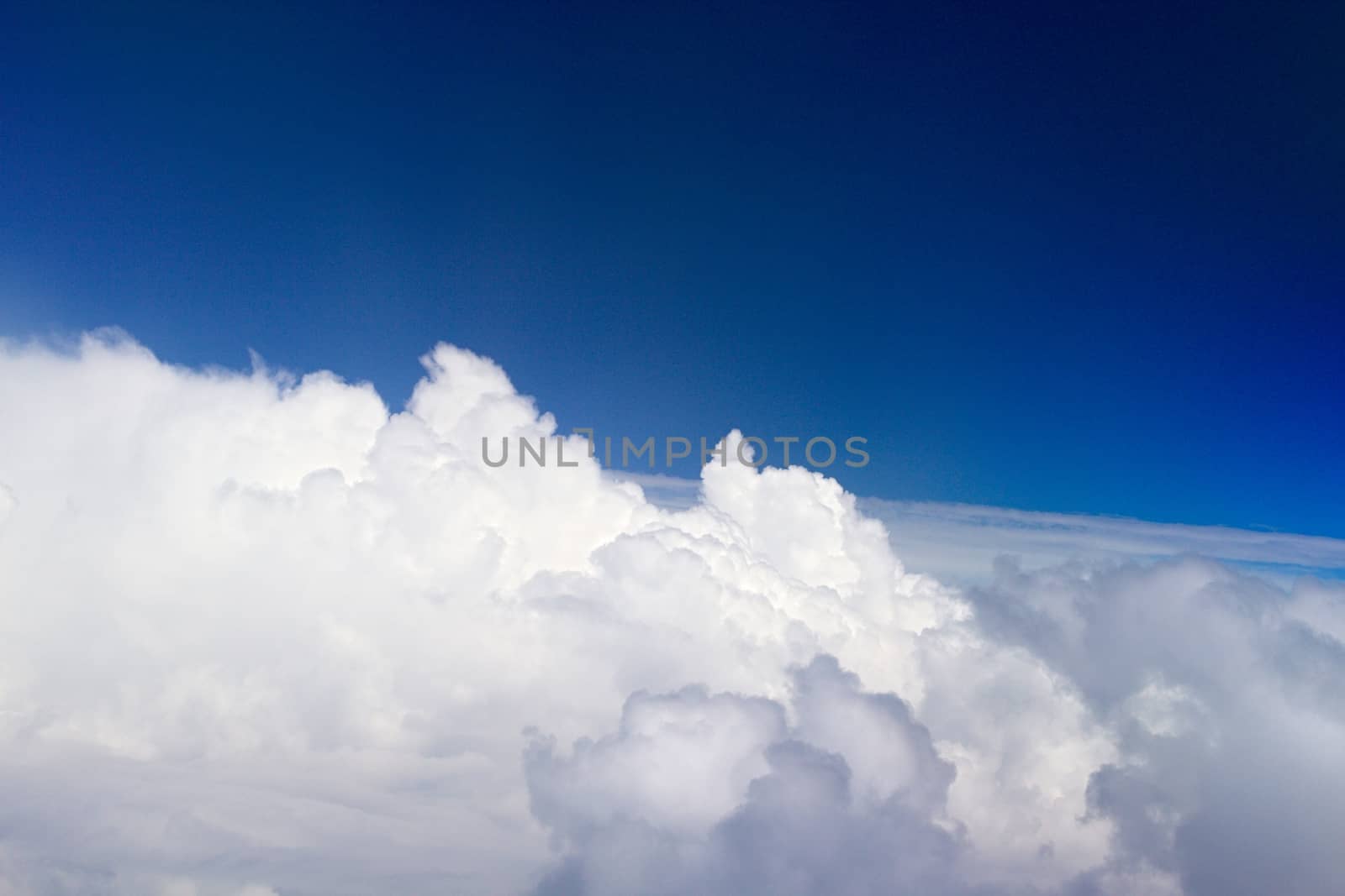 Photo shows details of white clouds and blue sky.