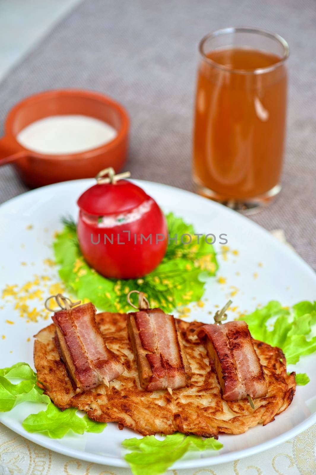 roast of veal meat with bacon with potatoes