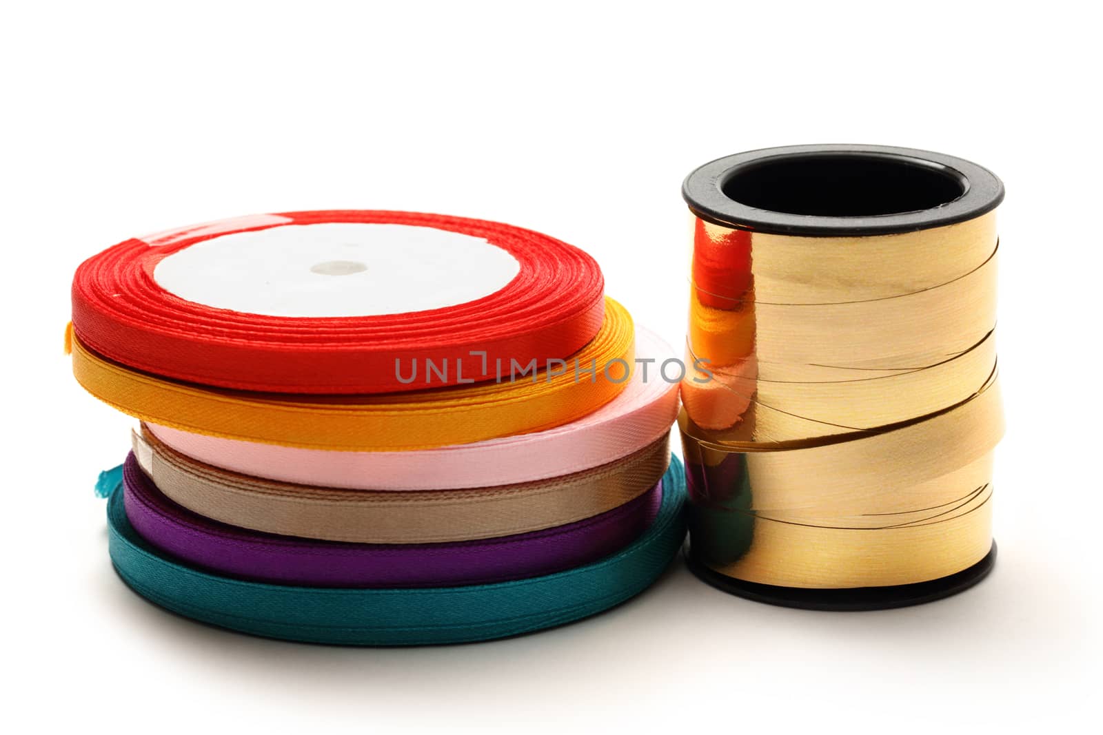 Reels of ribbon on the white background