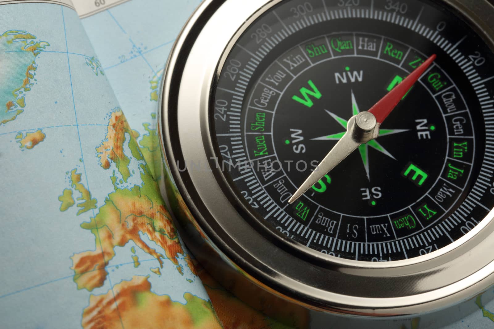 Compass on Earth map background
