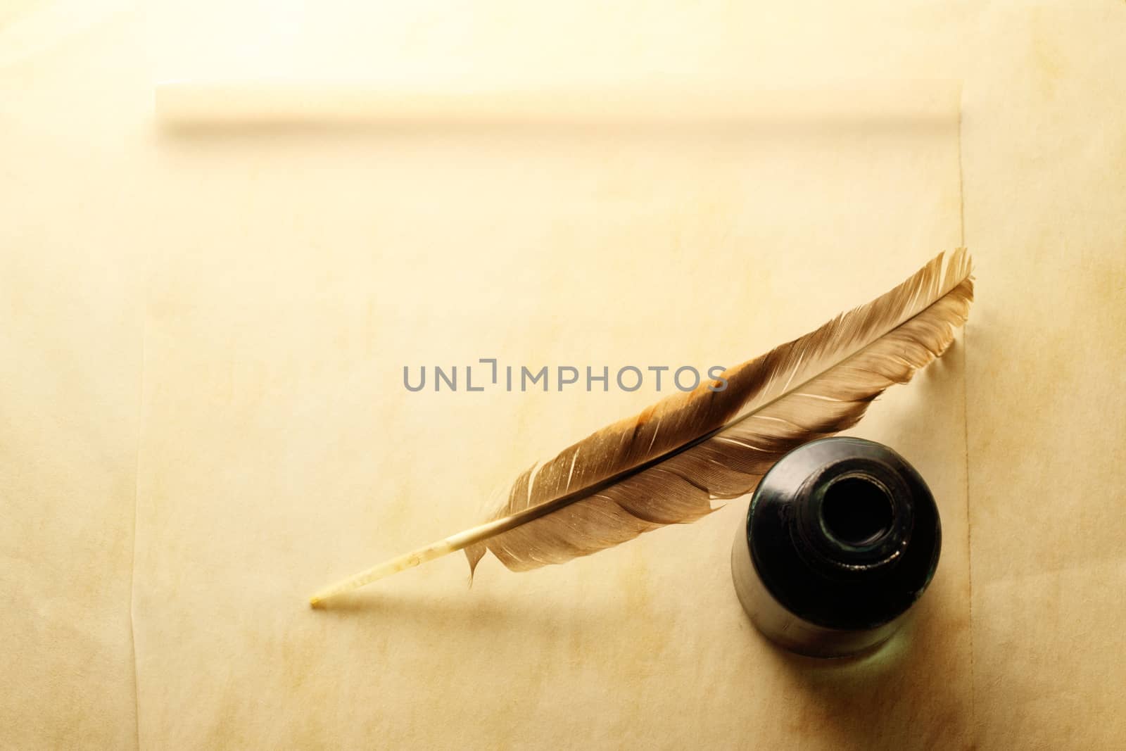 Blank envelope with inkwell and feather