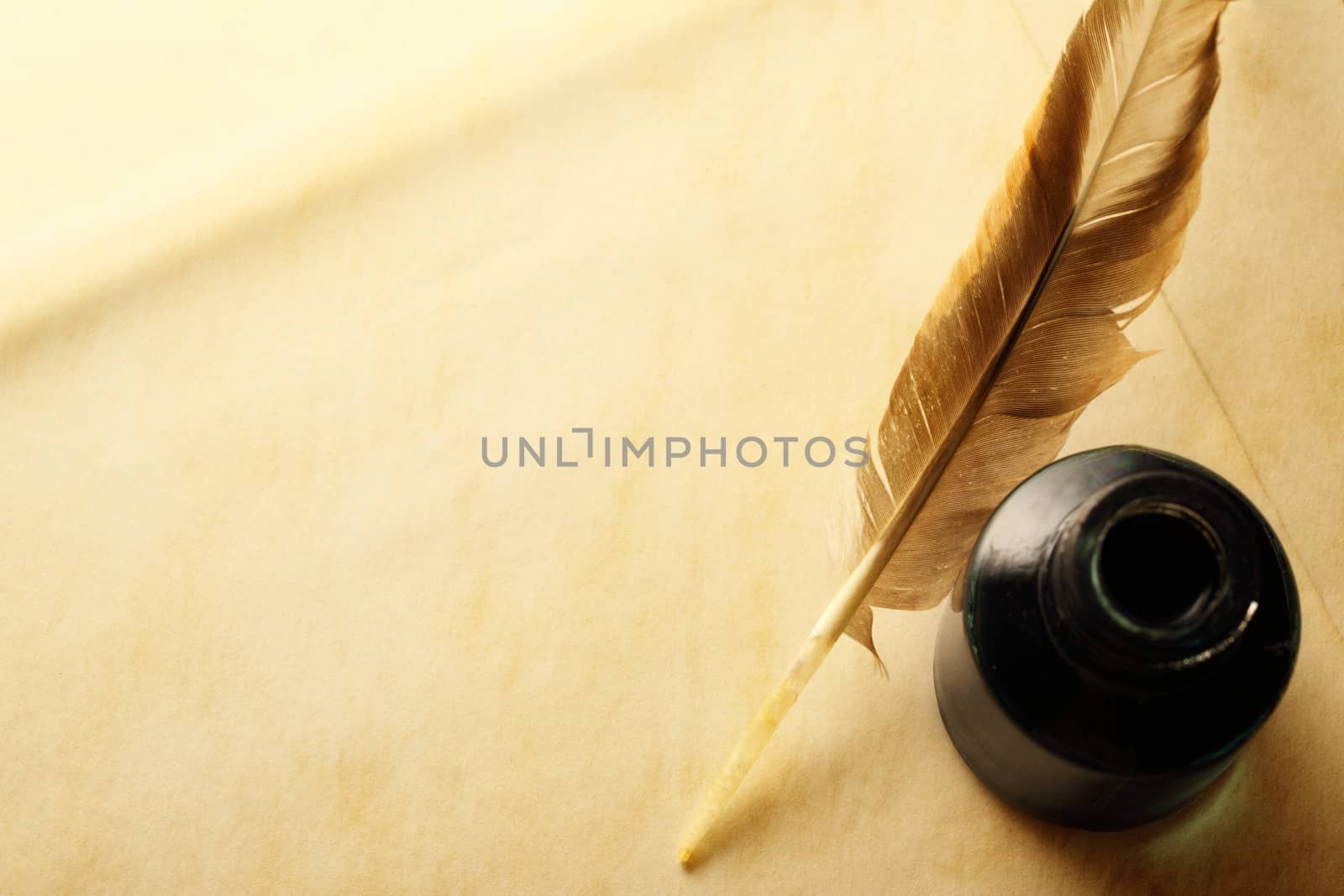 Blank envelope with inkwell and feather