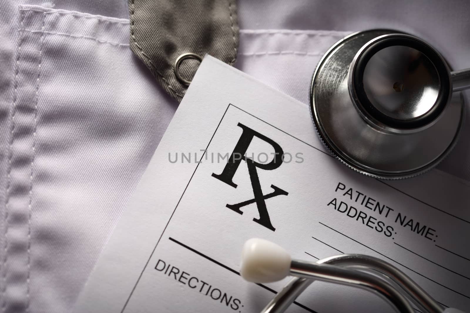 Stethoscope and patient list on doctor's smock