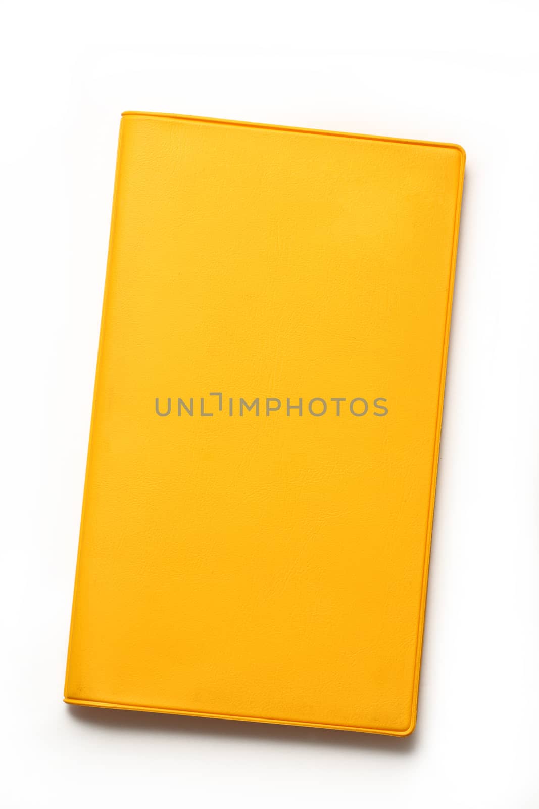Yellow blank book on white