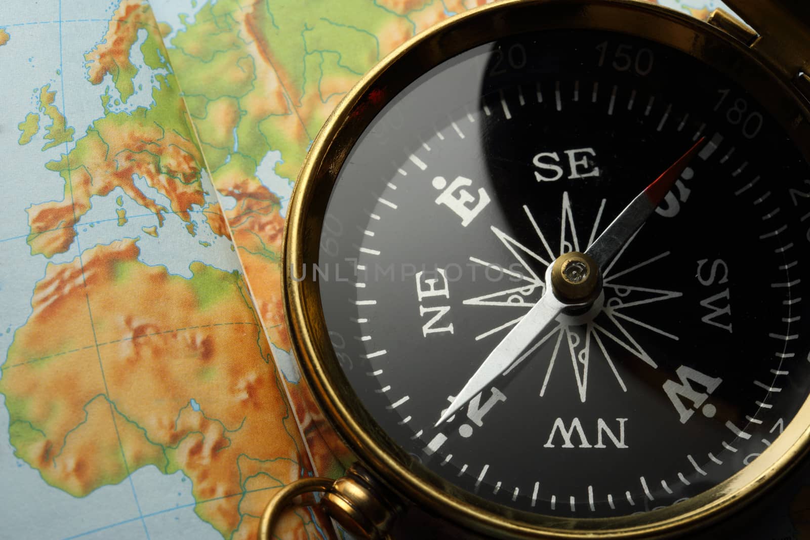 Compass on Earth map background