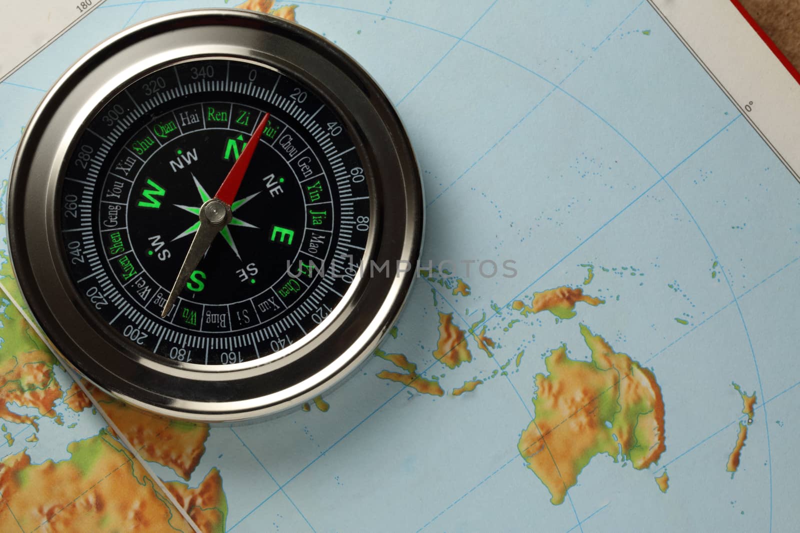 Compass on Earth map background
