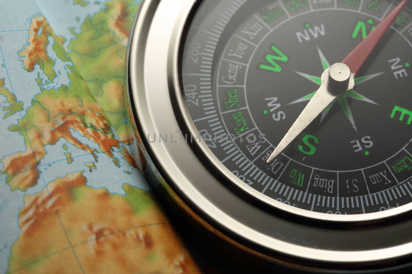 Compass on Earth map background