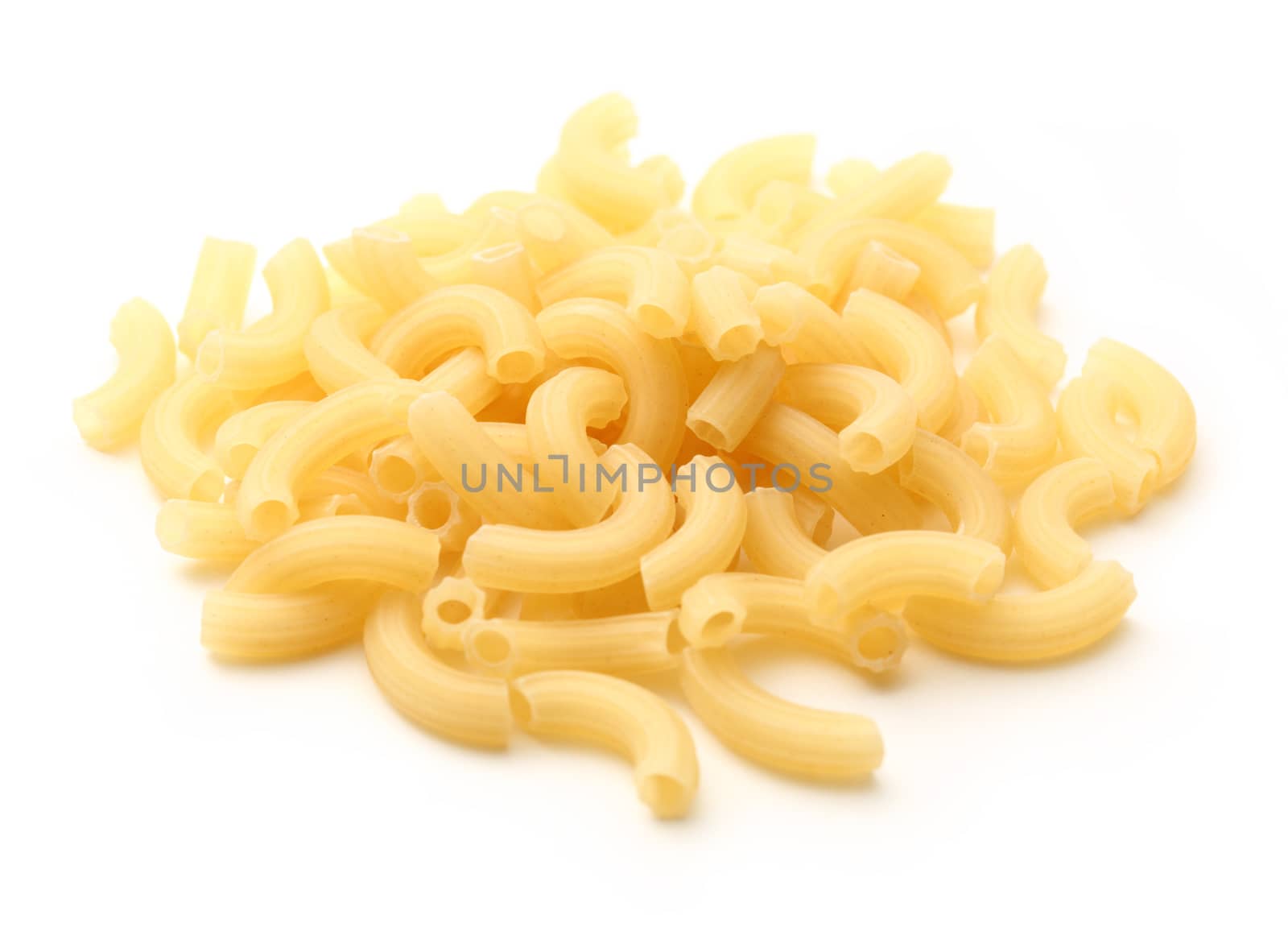 Short ribbed pasta tubes on white