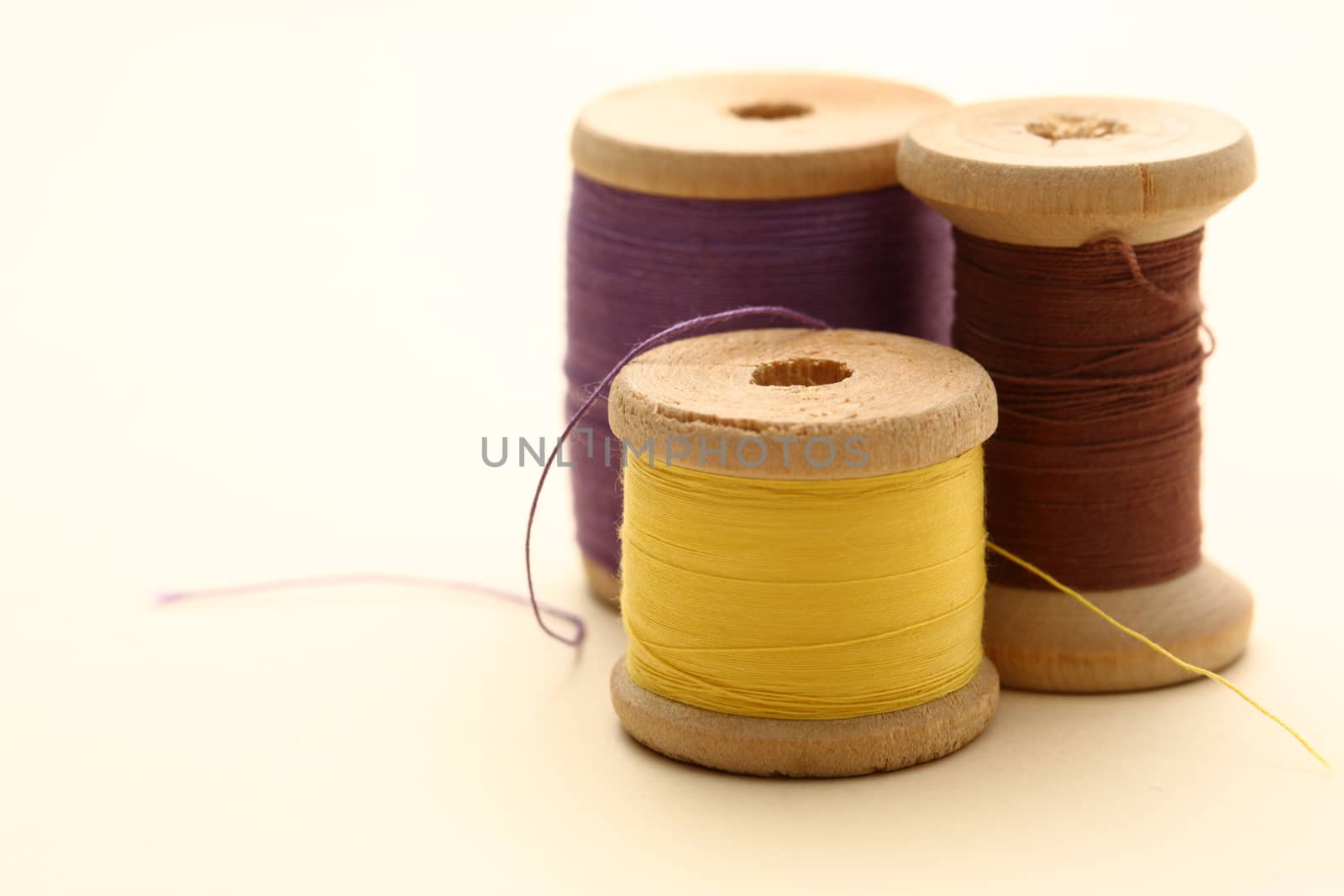 Thread bobbins on white background