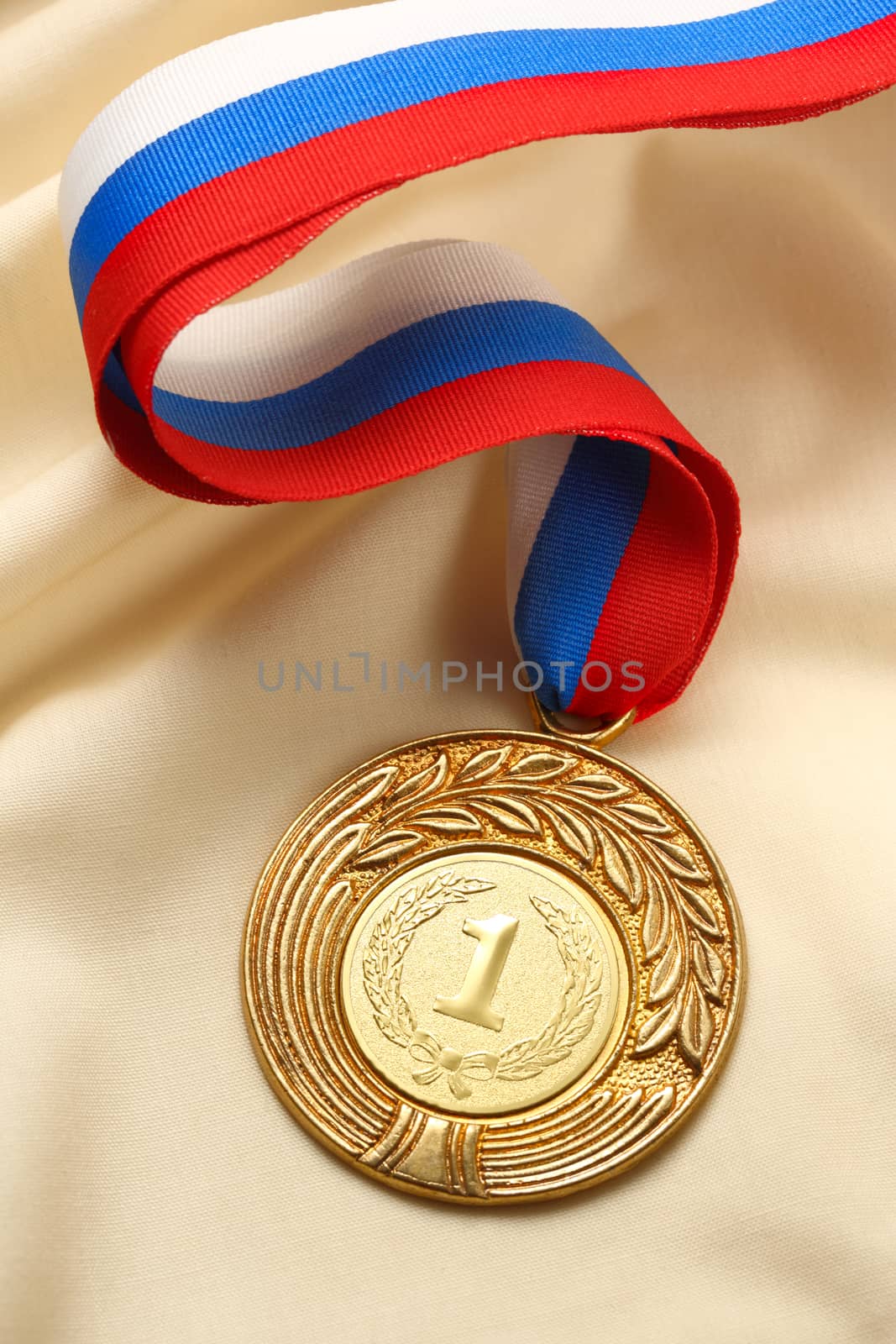 Metal medal on silk wrinkled cloth