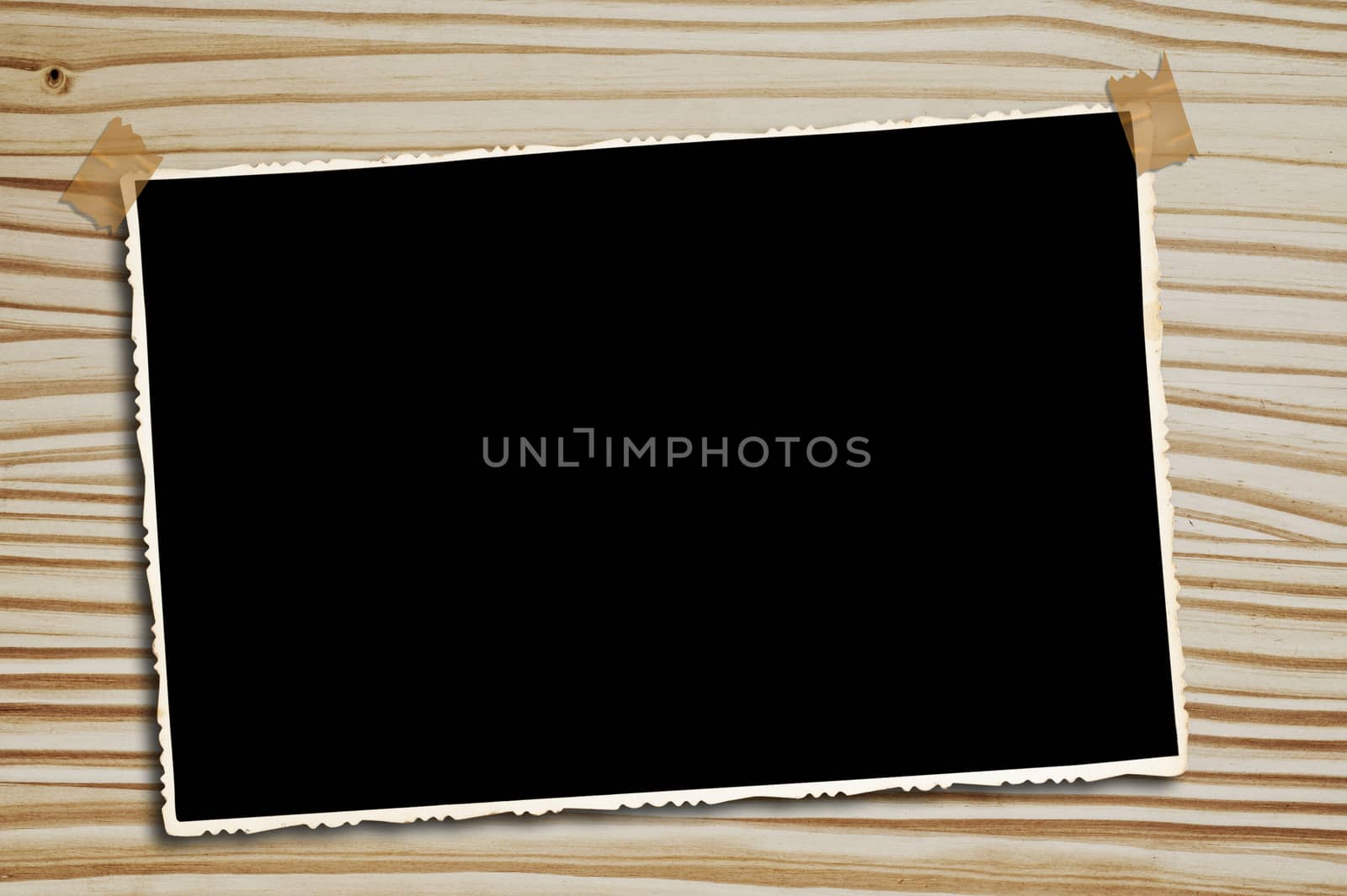  Vintage blank photograph on a wooden table.