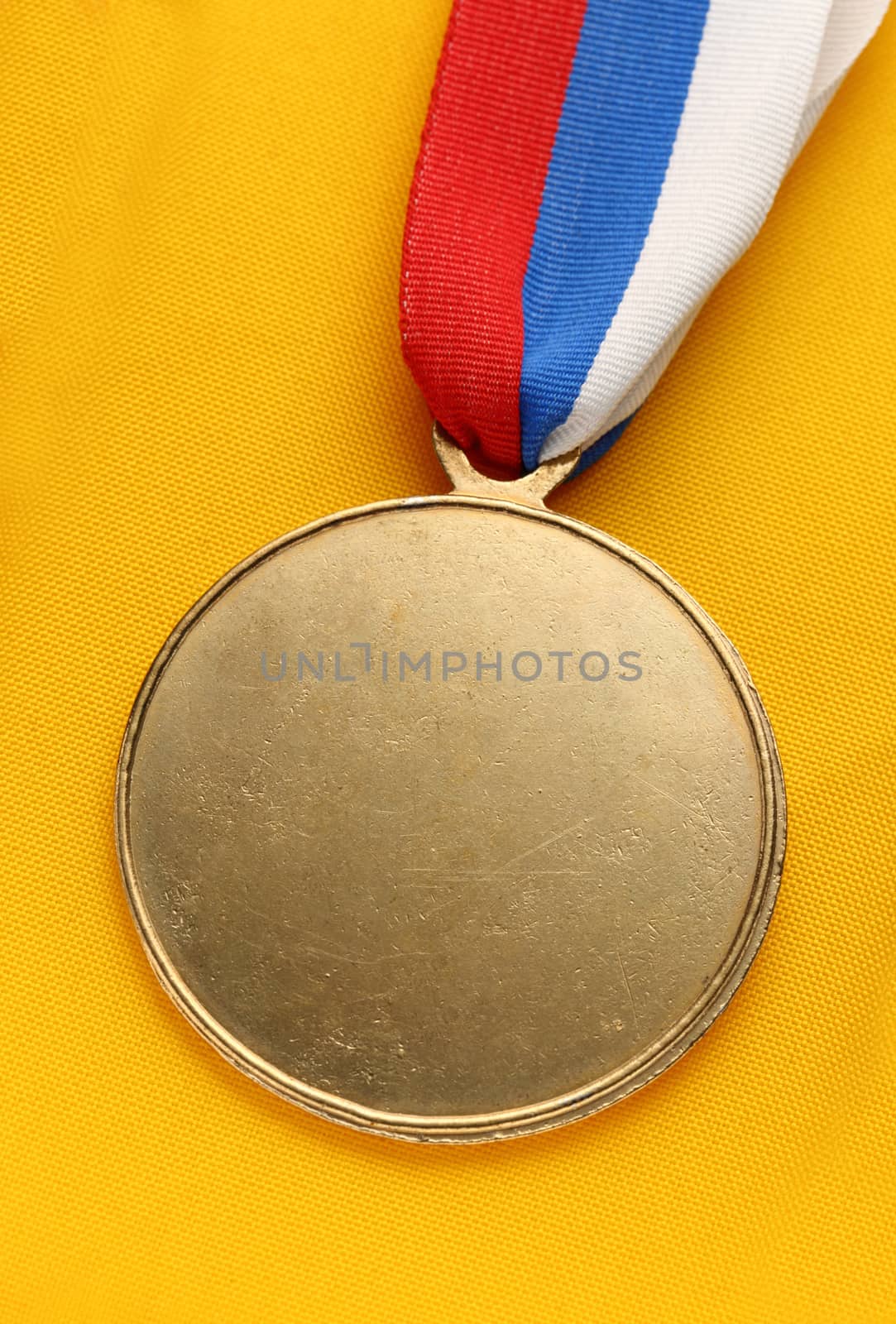 Metal medal with tricolor ribbon