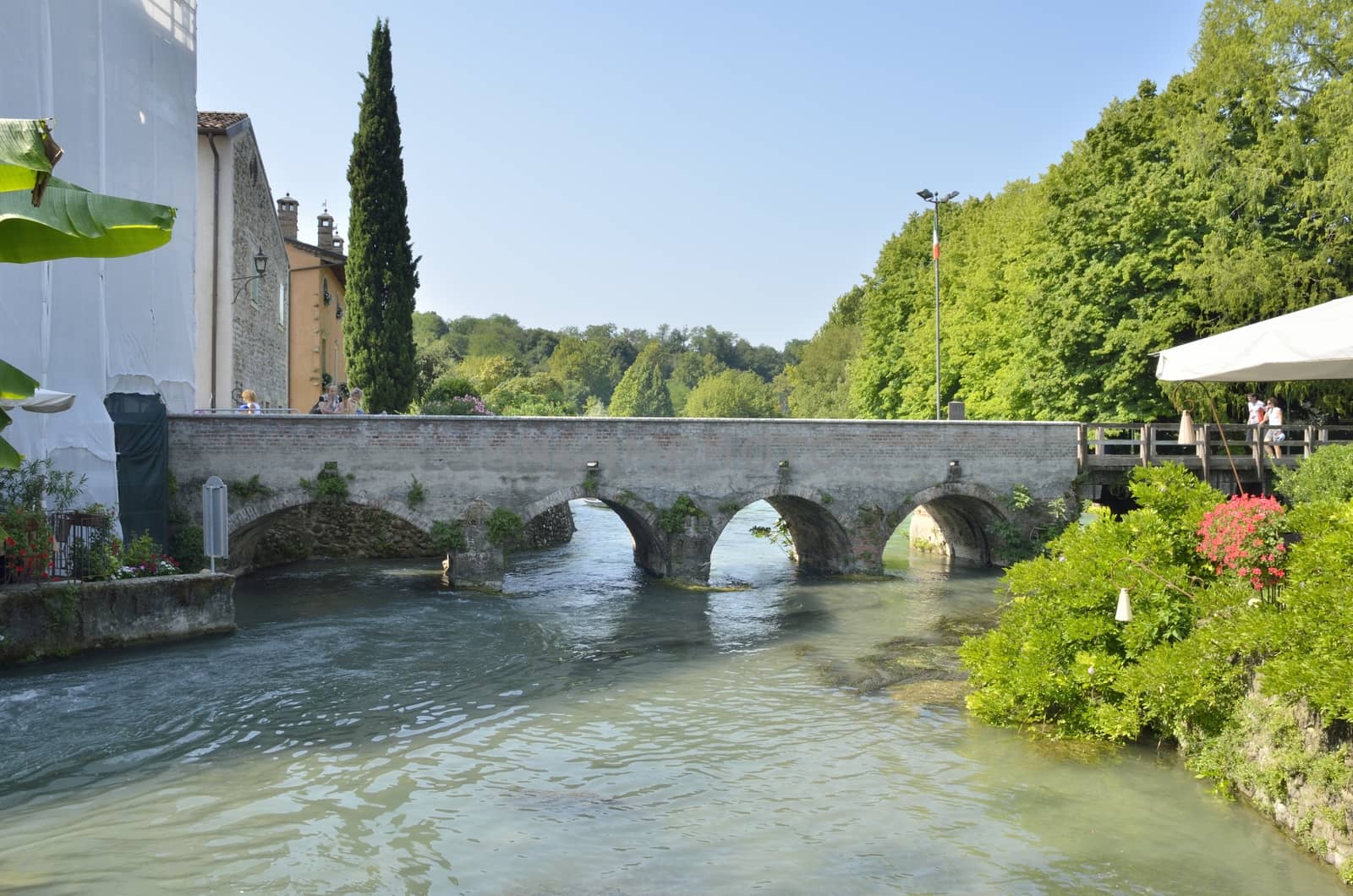 Bridge over the river Mincio, in Borguetto, an ancient village  in the municipality of Valeggio, in the province of Verona, Italy.