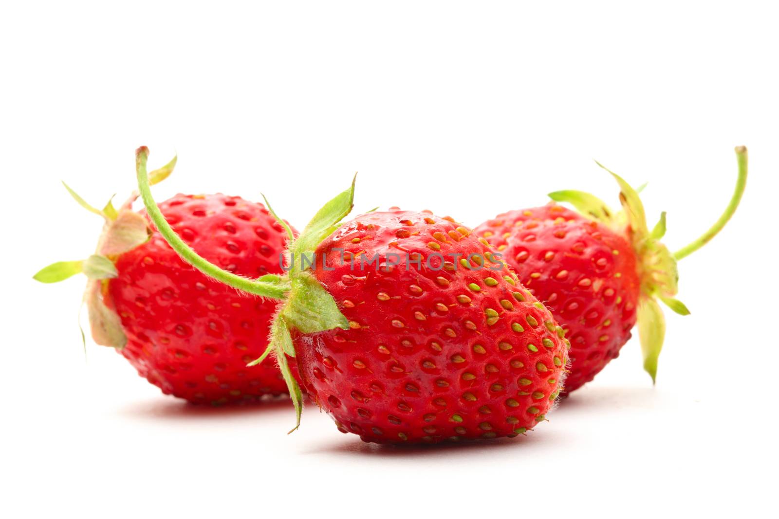 Ripe strawberry on white background by Garsya