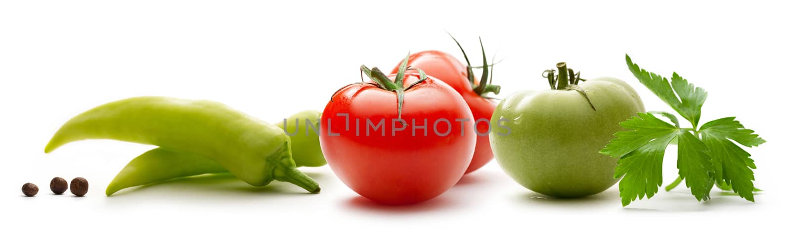 Red and green tomatoes with paprika and pepper