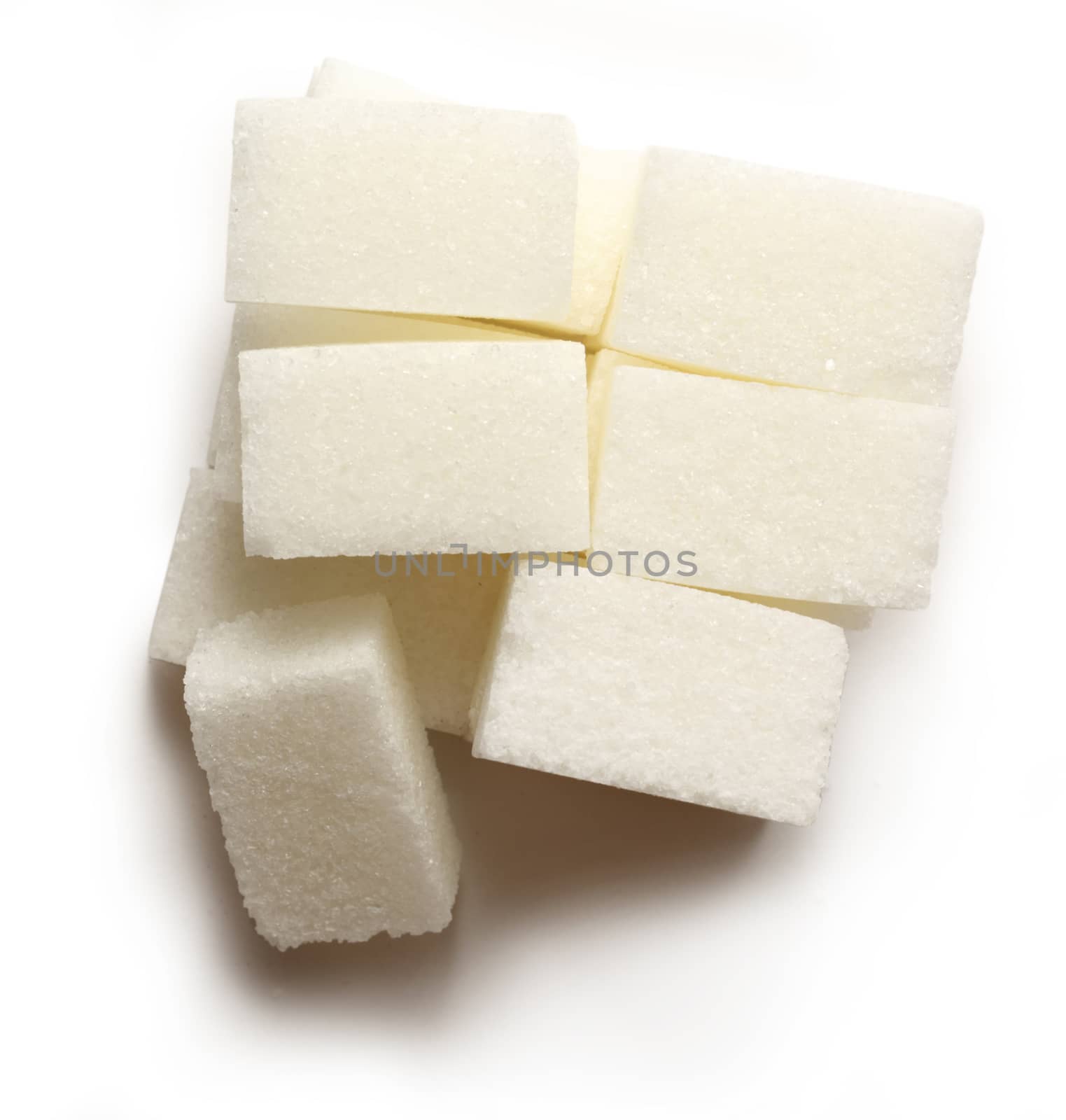 Sugar cubes on the white background