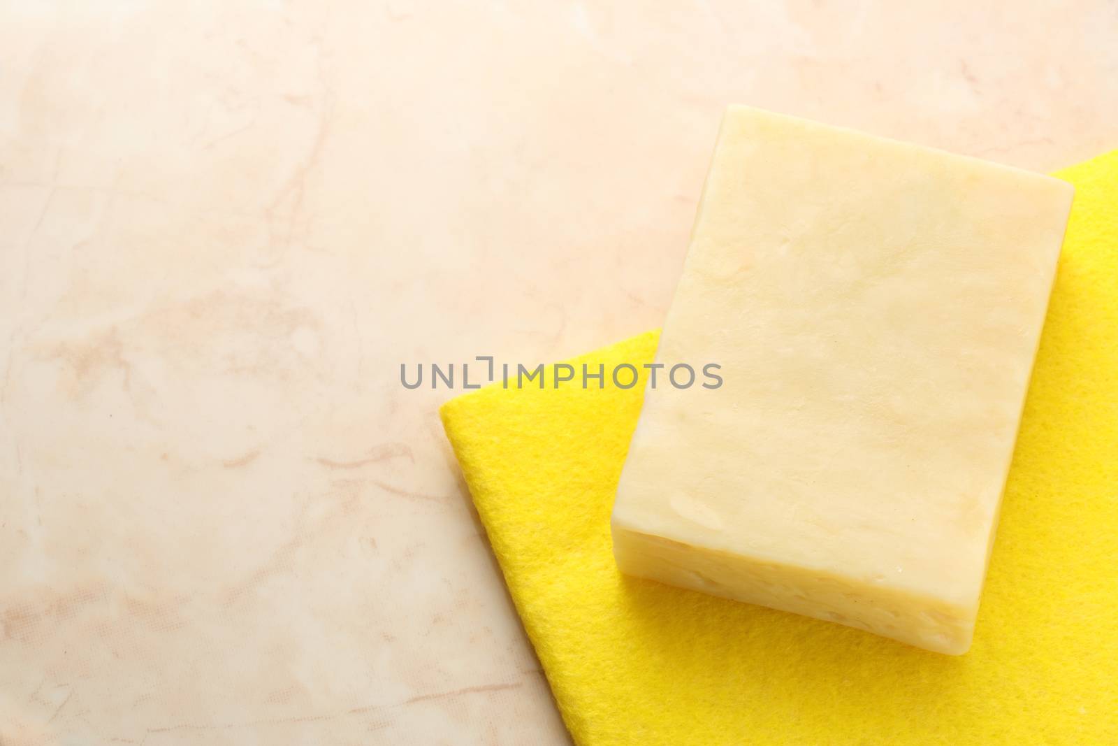Bar of soap and cloth on tile