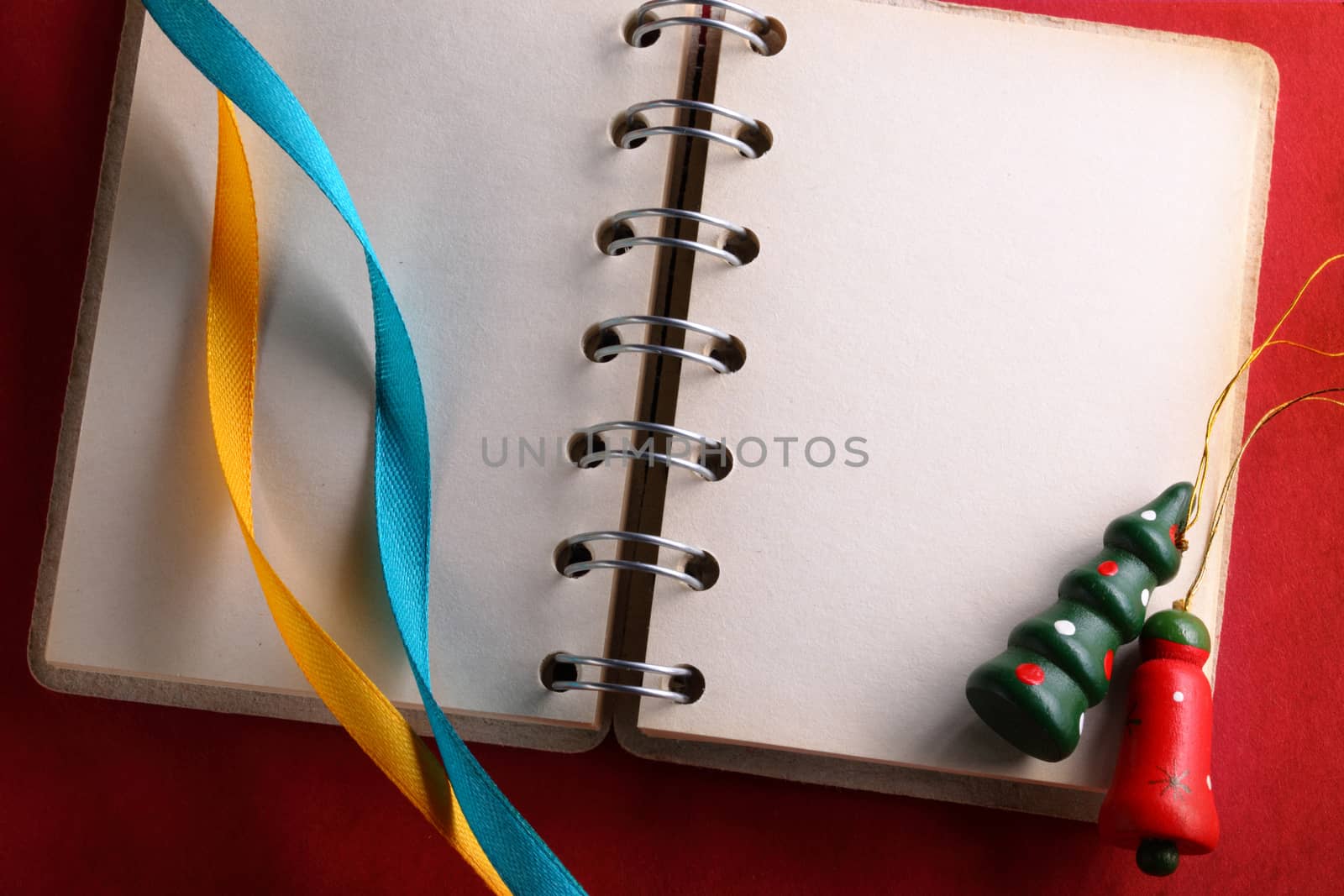 Open notebook with two ribbons