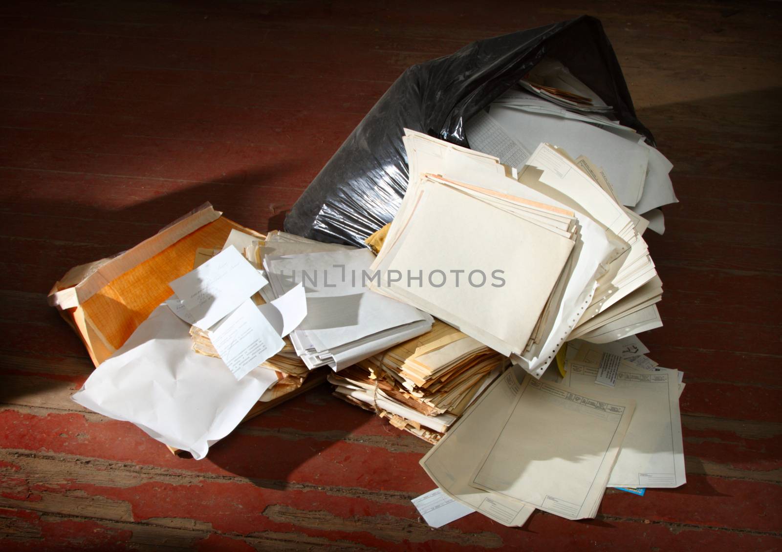 Messy workplace with stack of paper