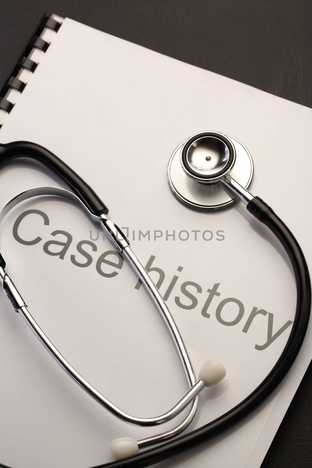 Case history and stethoscope by Garsya