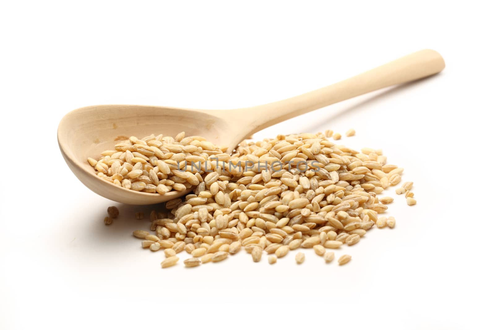 Pearl barley and wooden spoon