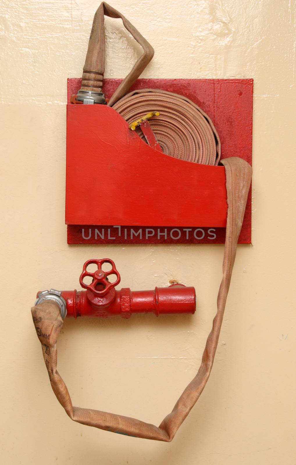 Red fire hose and cock