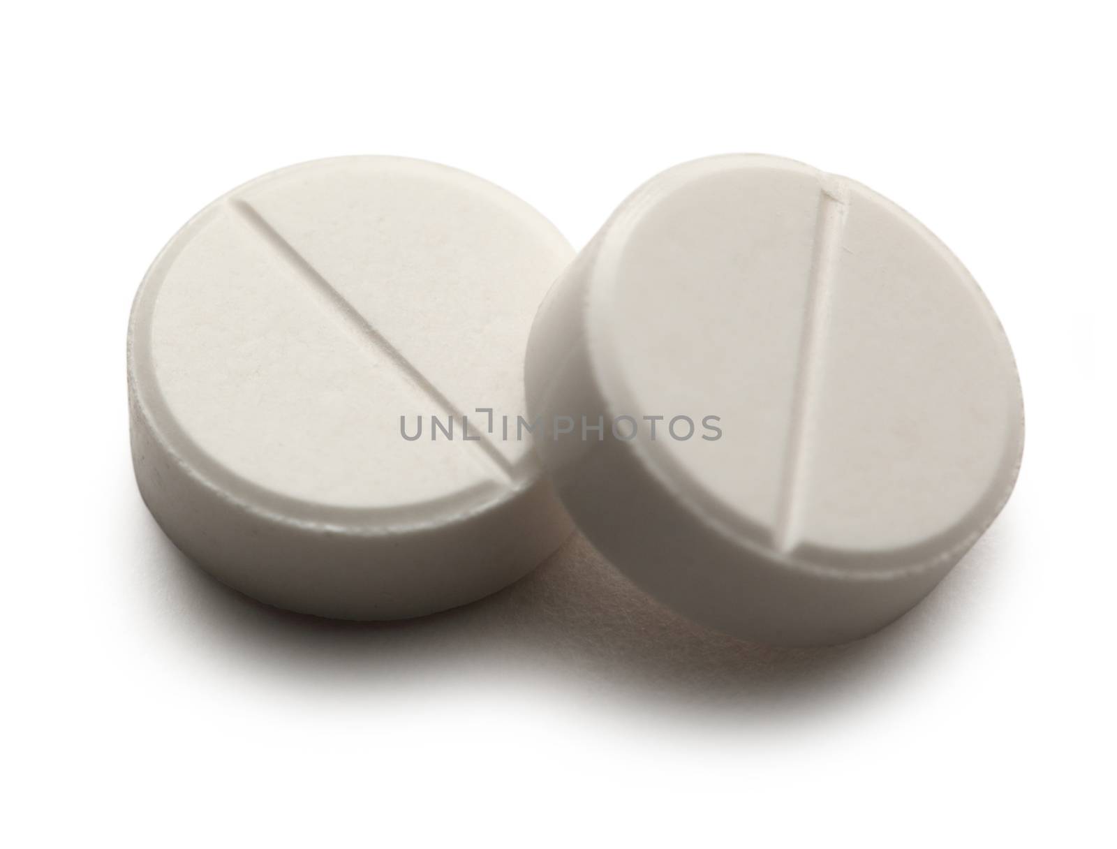 Aspirin pills on white background