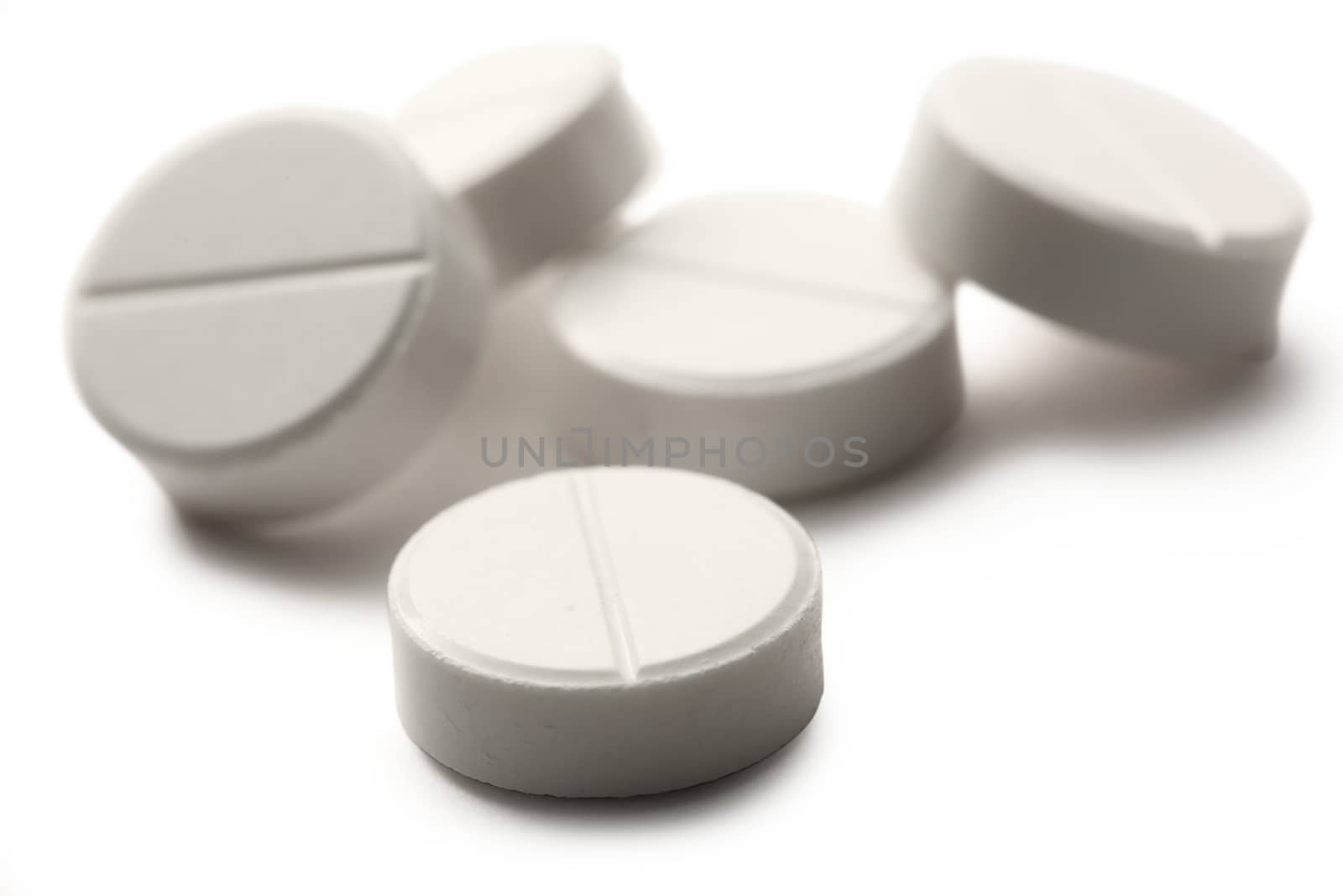Aspirin pills on white background
