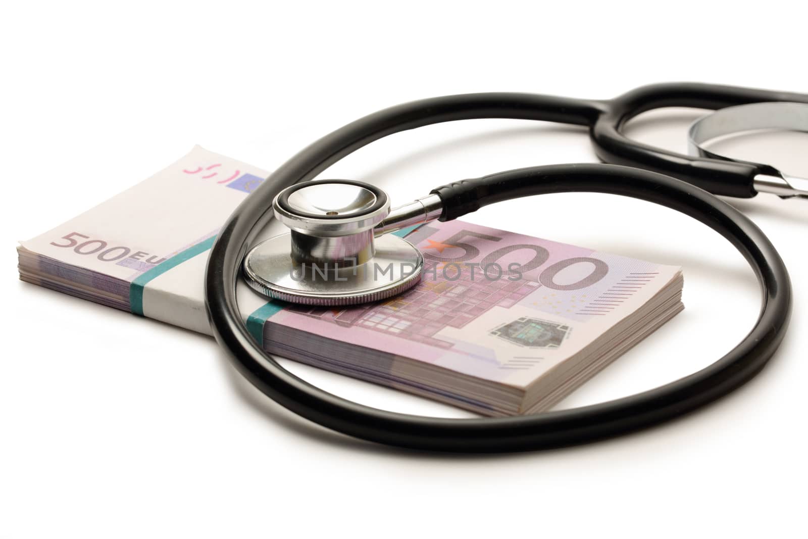 Stethoscope and euro banknotes cash closeup