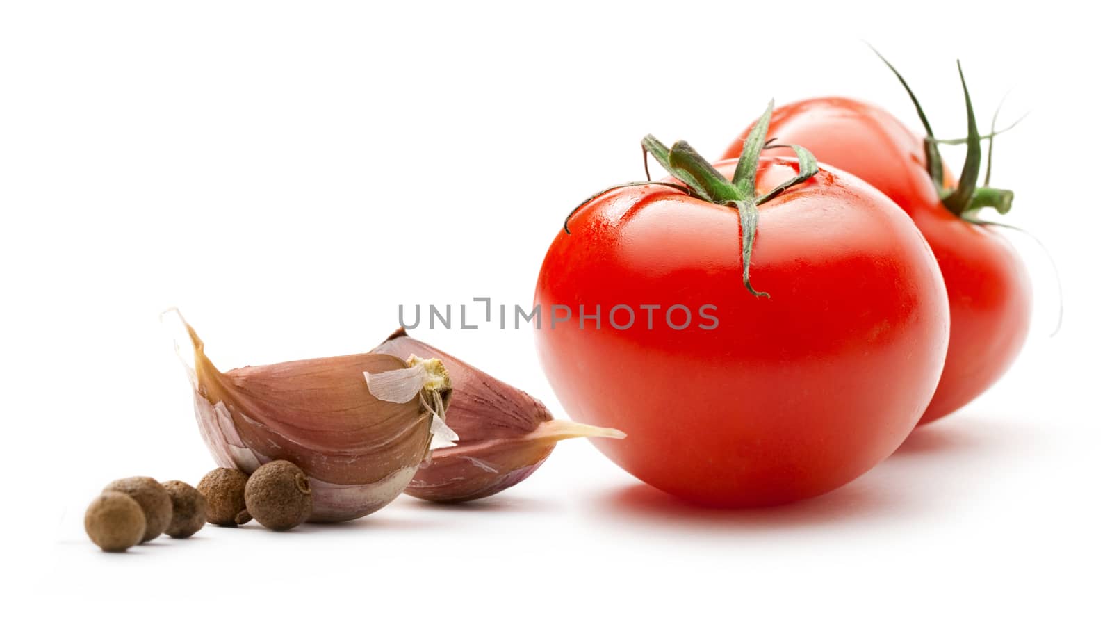 Tomatoes, onion and pepper on white background