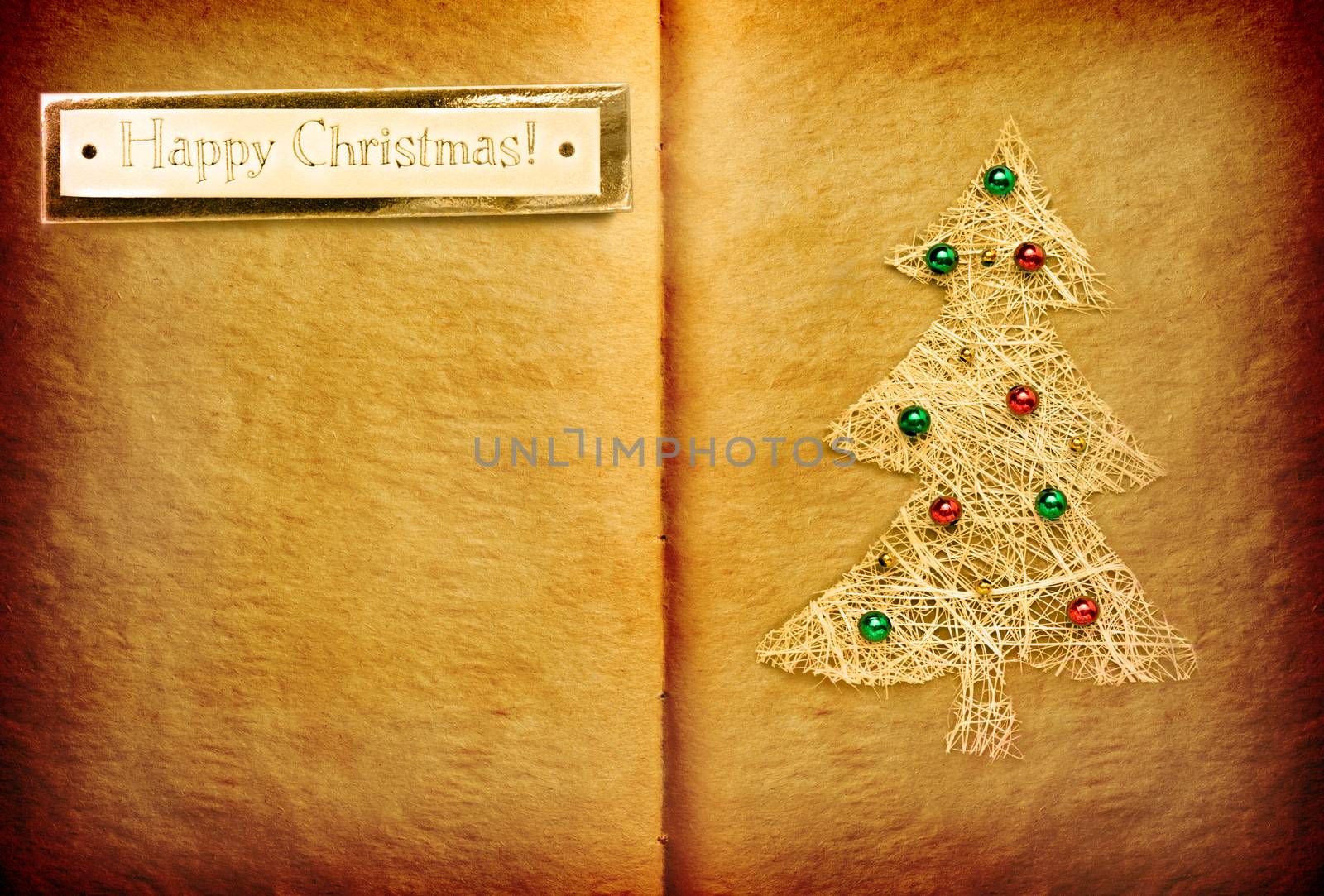 Open book with Happy Christmas label