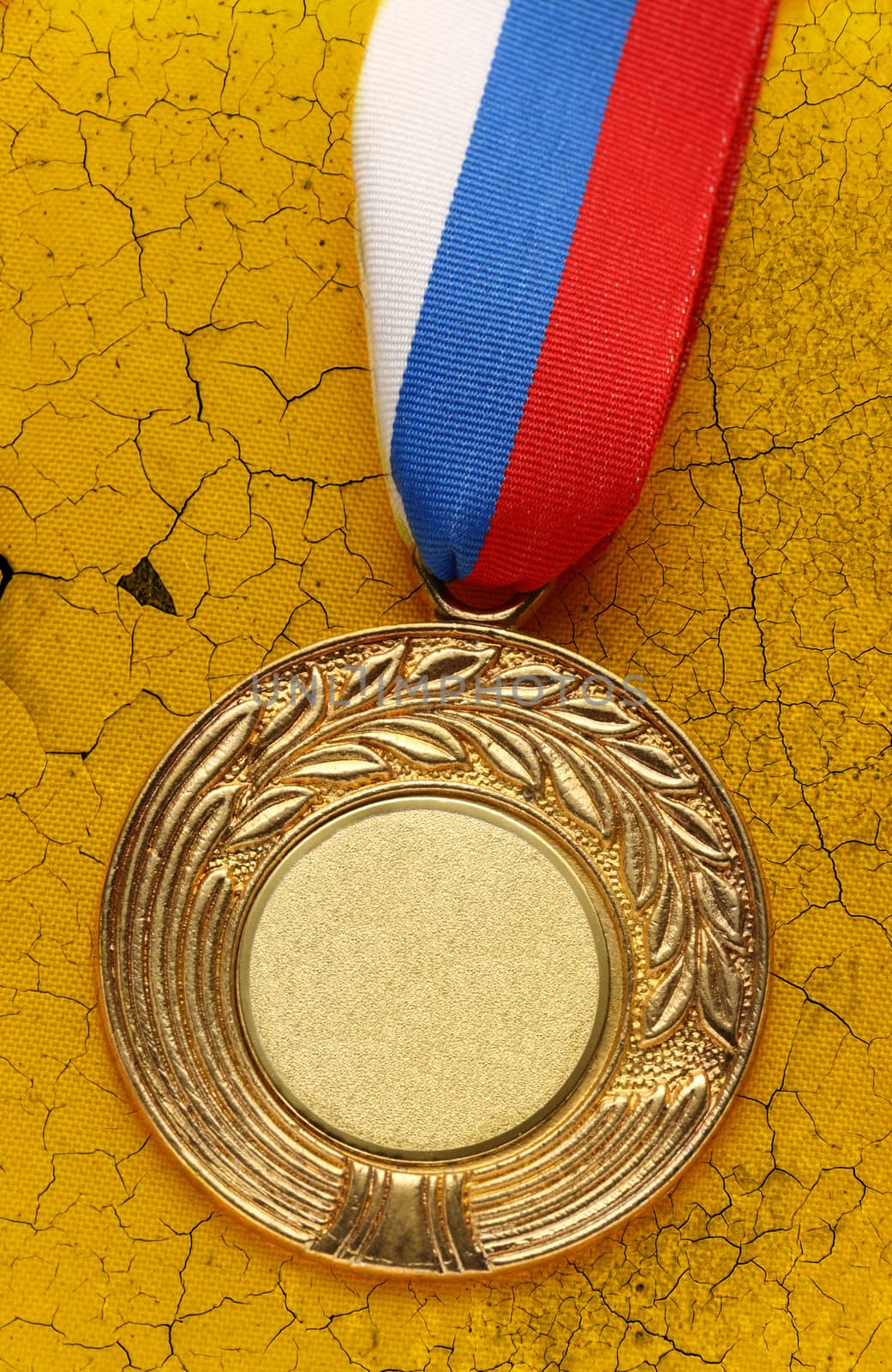 Medal on cracked piece of old wall