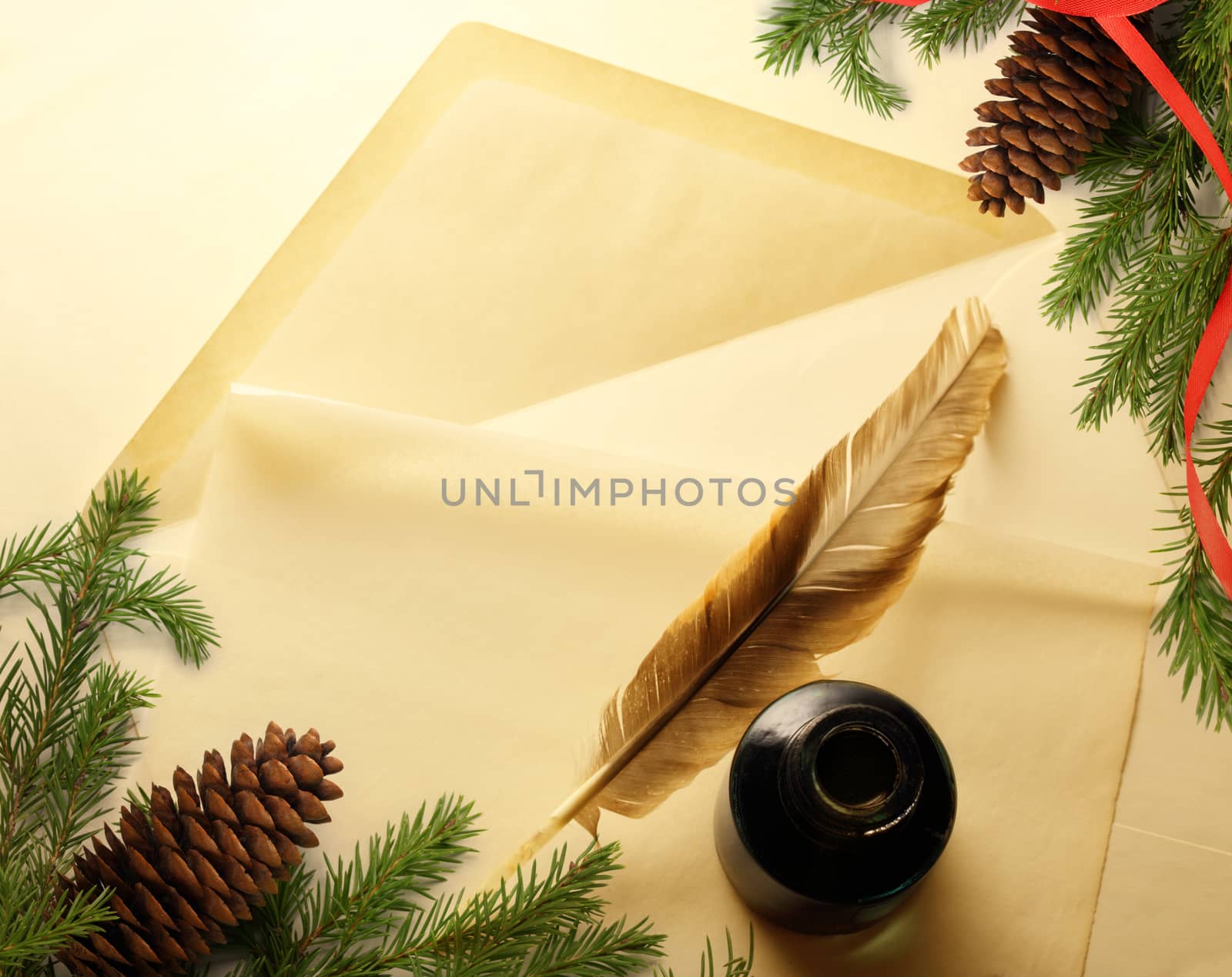 Christmas decoration on envelope with inkwell and feather