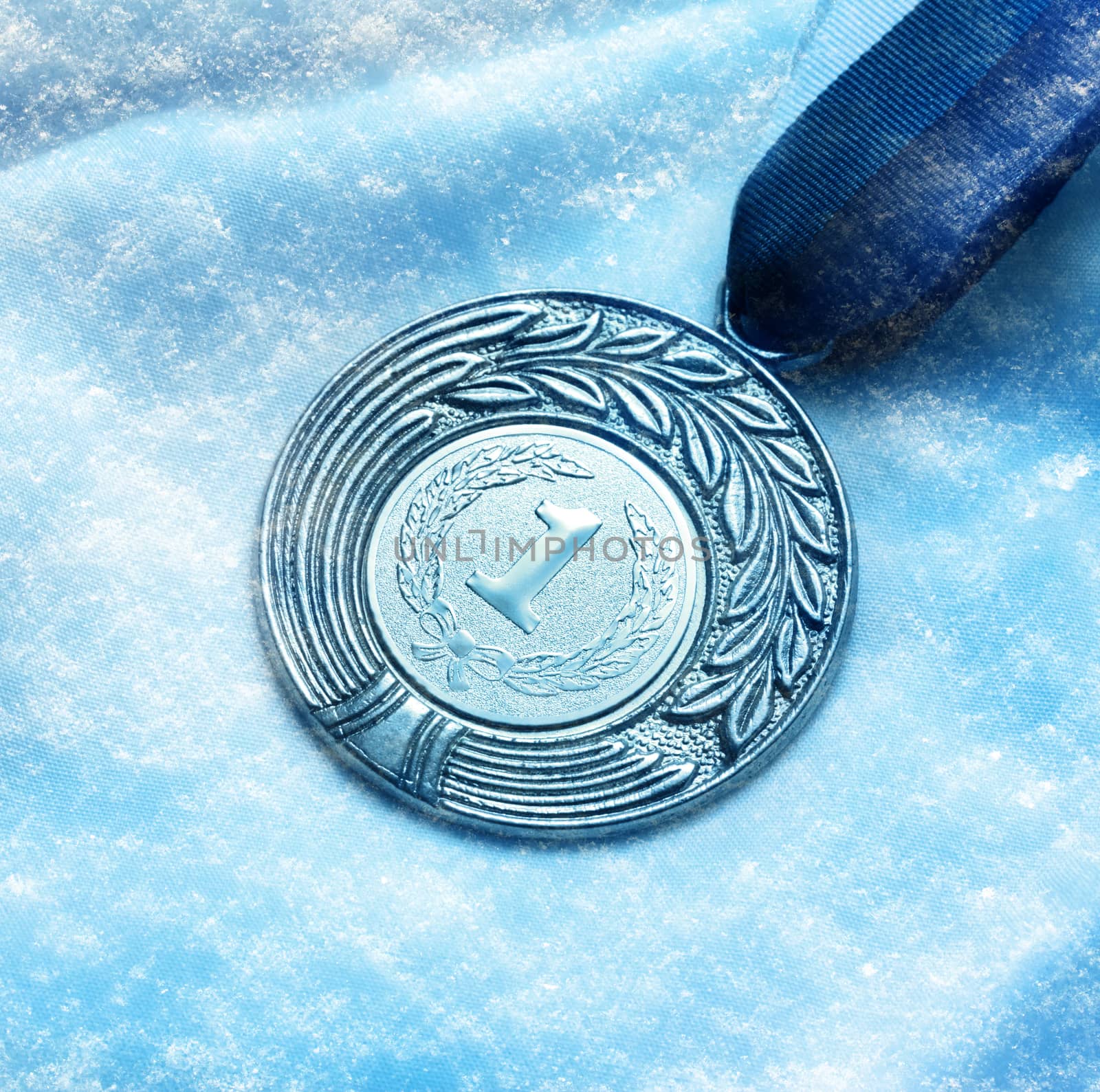 Metal medal on snow background