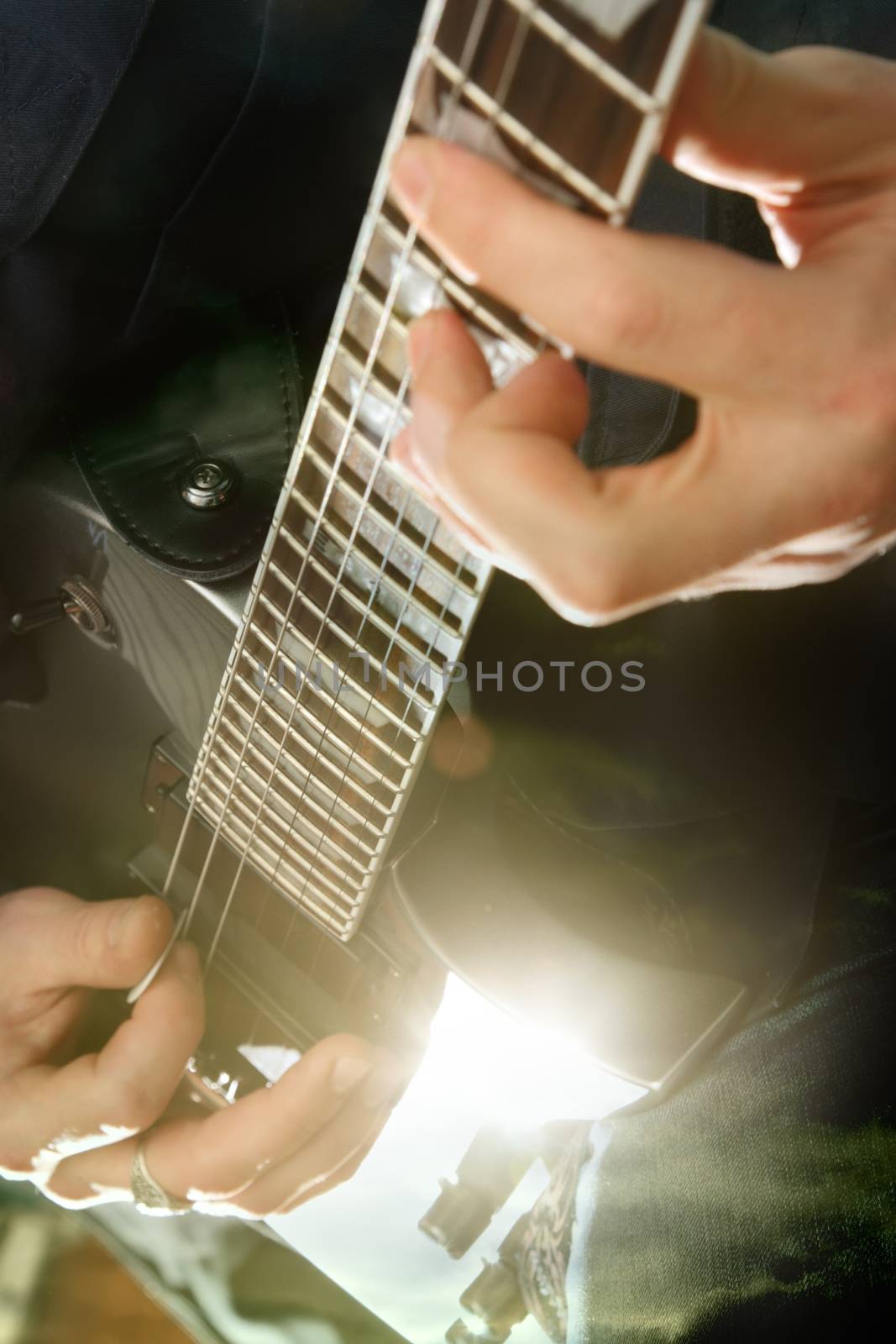 Electric guitar in male hands