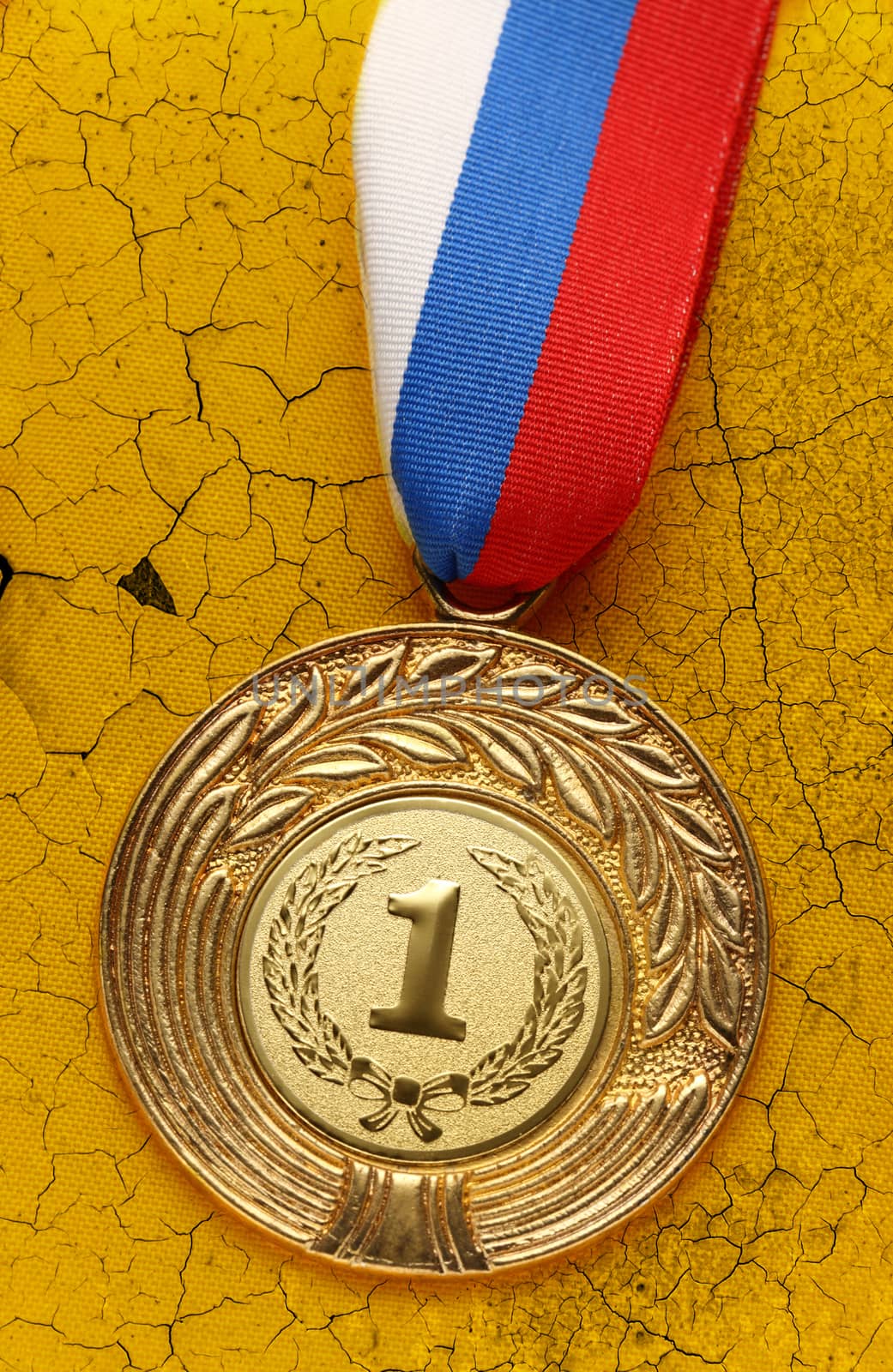 Medal on old wall by Garsya