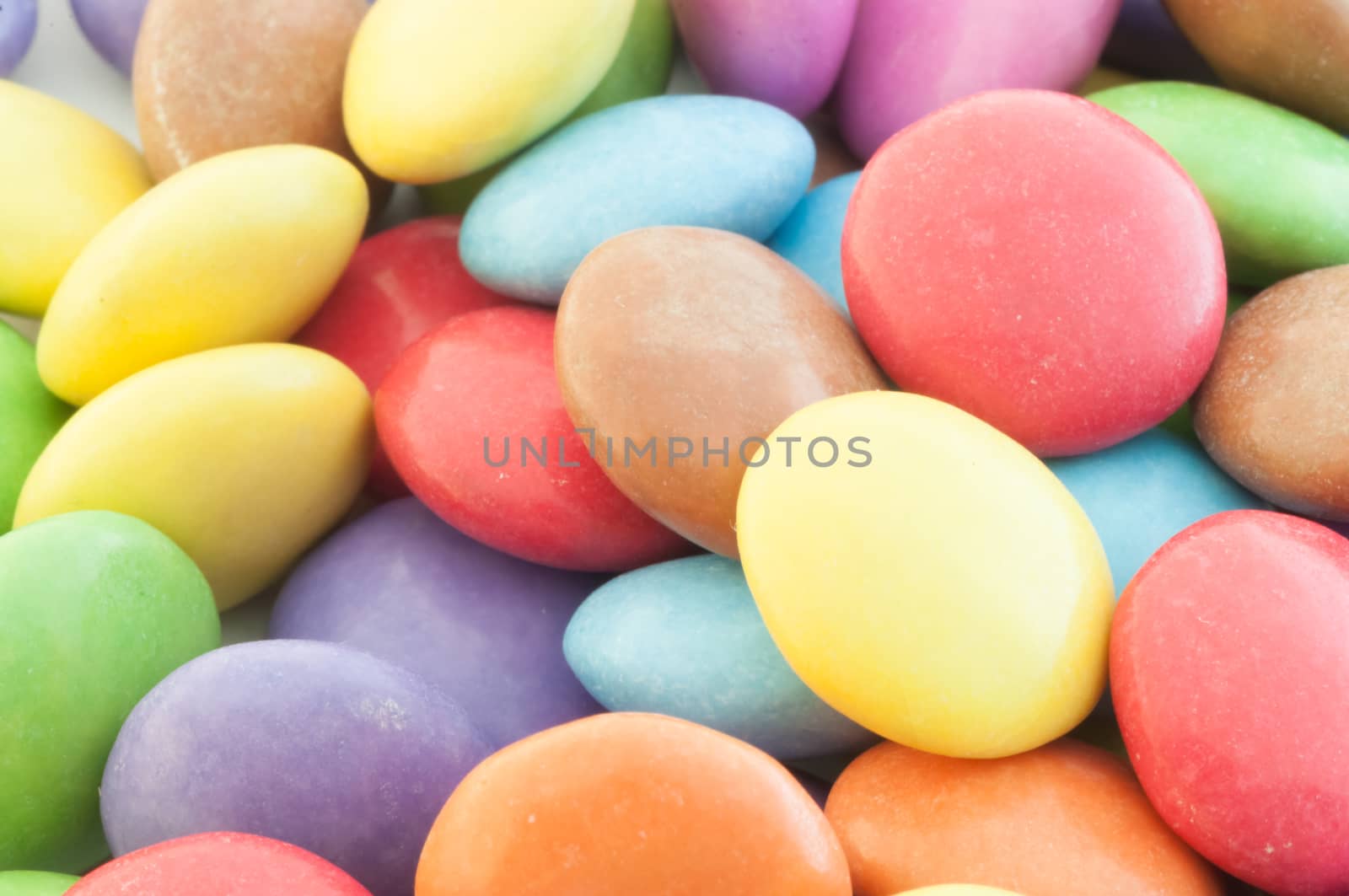 beautiful background of circular colored and various candy or pills