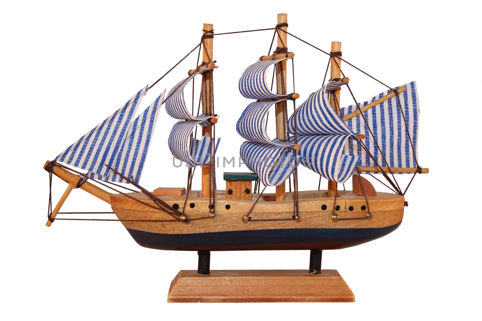 Wooden ship toy model, isolated on white background.