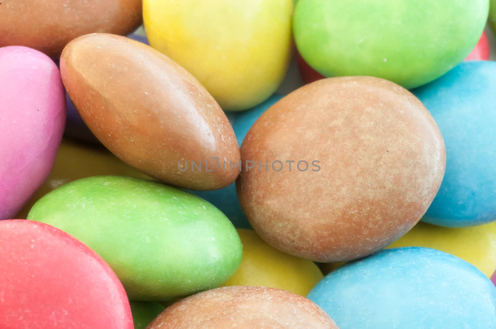 beautiful background of circular colored and various candy or pills