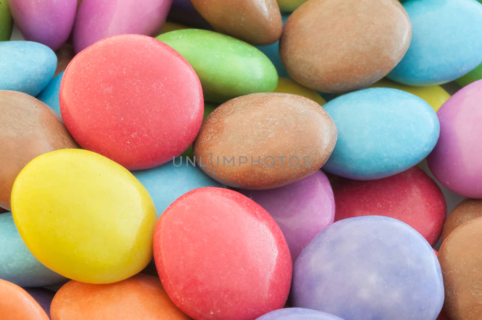 beautiful background of circular colored and various candy or pills