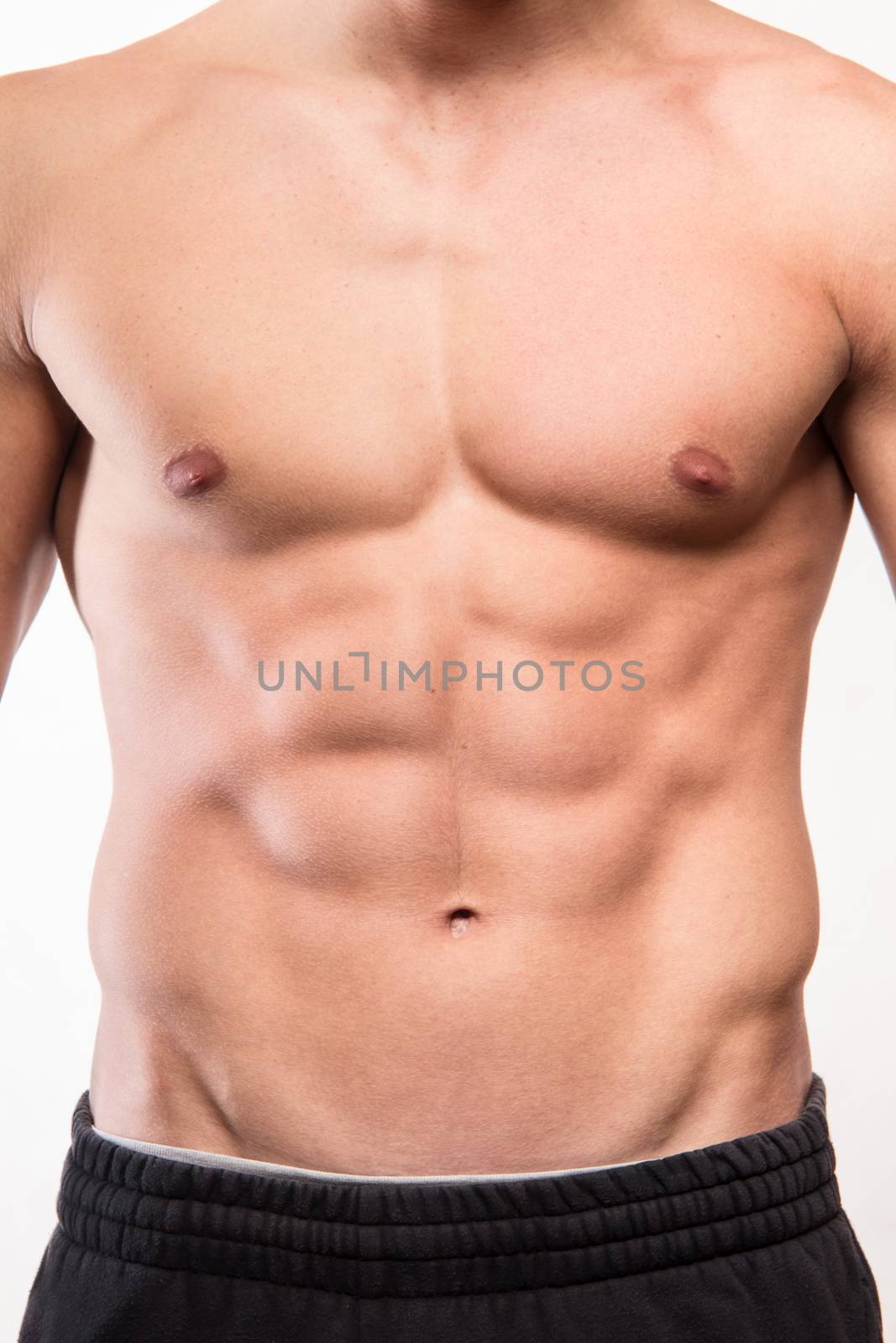 Muscular fitness man torso with six pack 