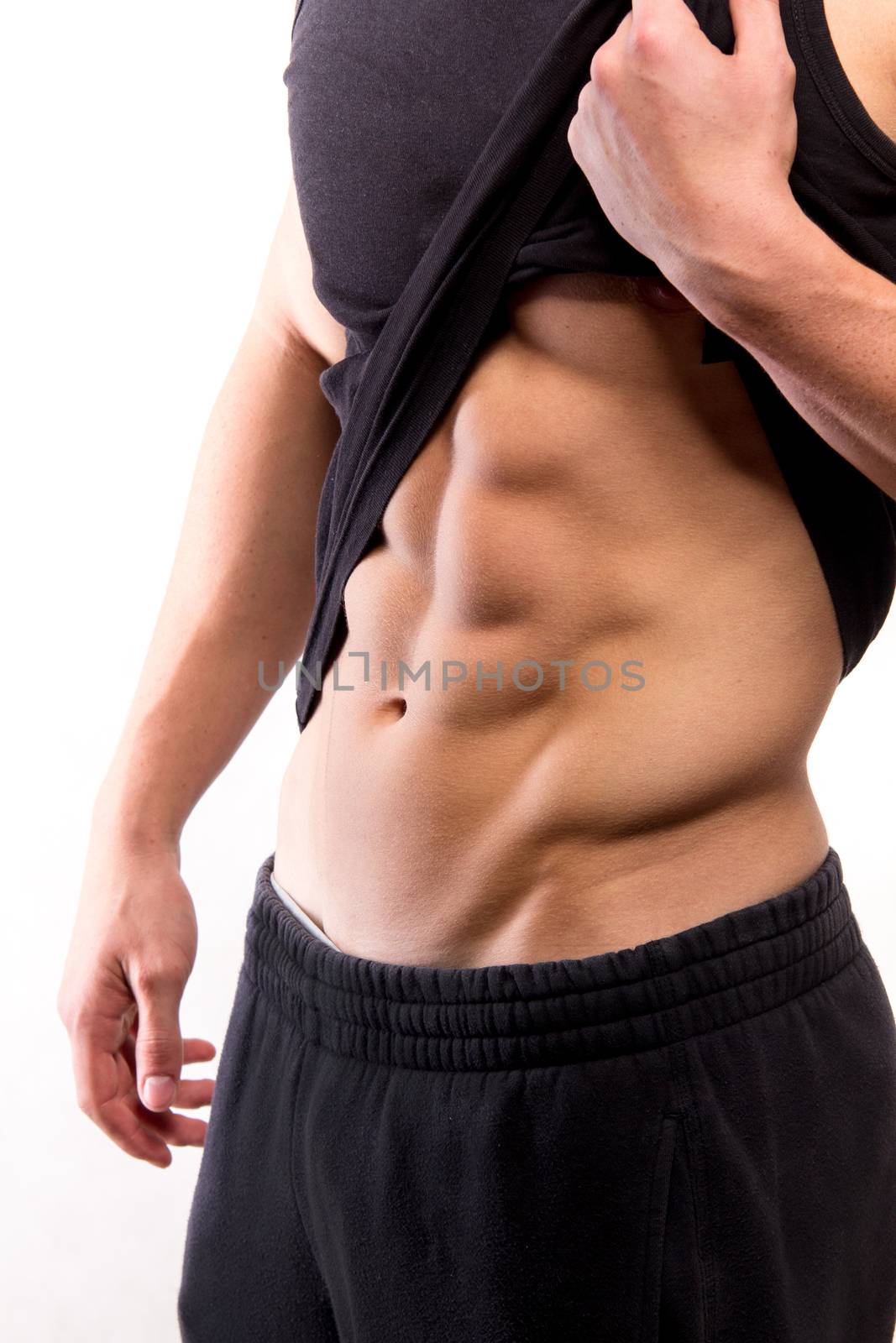 Muscular fitness man torso with six-pack - studio shoot