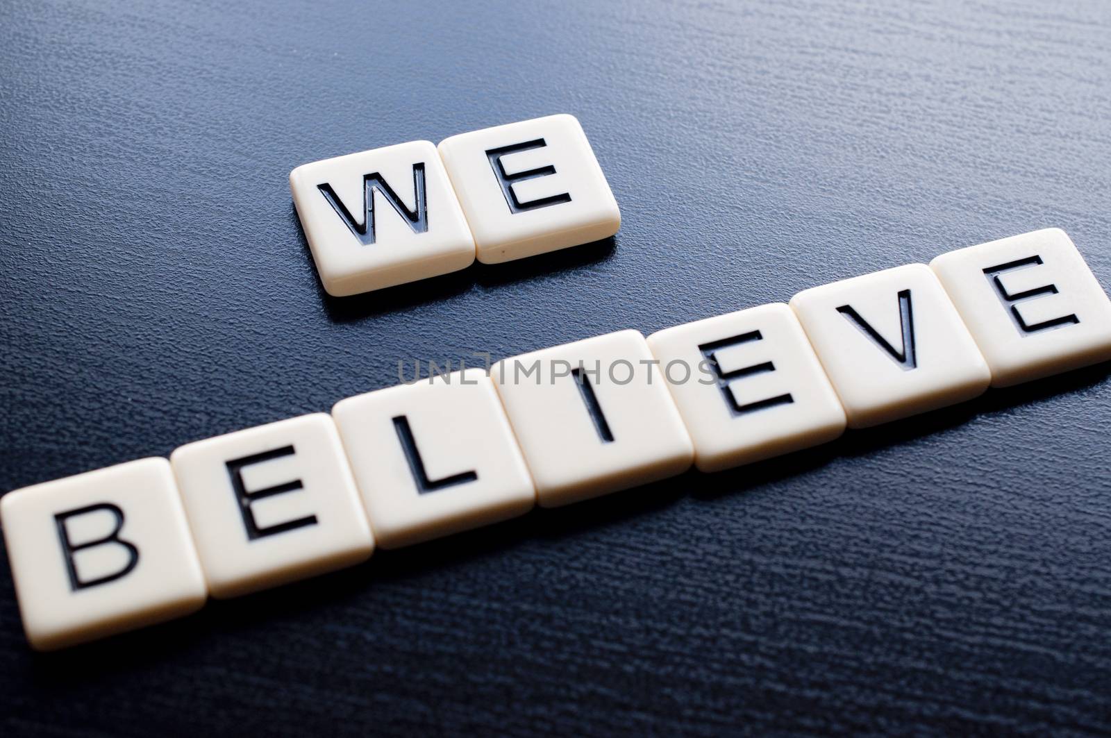 Alphabet Blocks spelling the words we believe