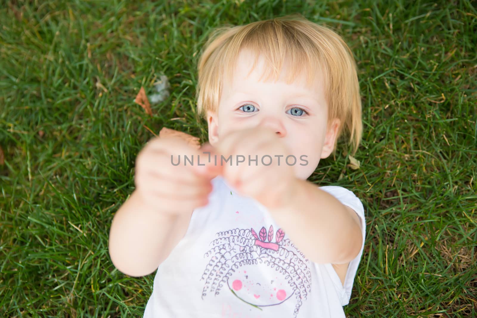 Outdoor portrait  of cute little girl in summer day